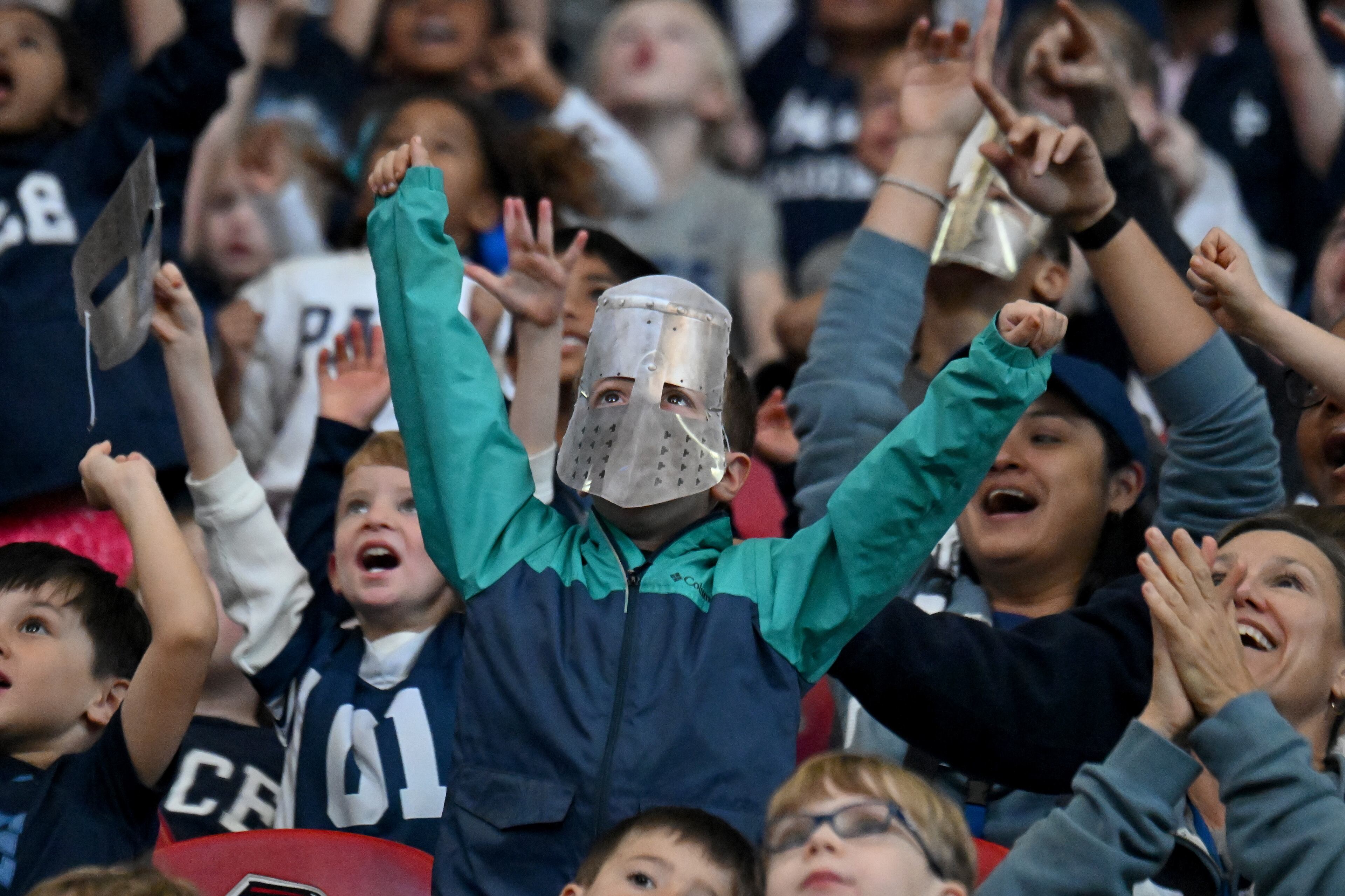 Pace Academy fans cheer during the first half in 2024 GHSA Division 3 Flag Football Championship game at Mercedes-Benz Stadium, Tuesday, December 17, 2024, in Atlanta. Pope won 19-6 over Pace Academy. (Hyosub Shin / AJC)
