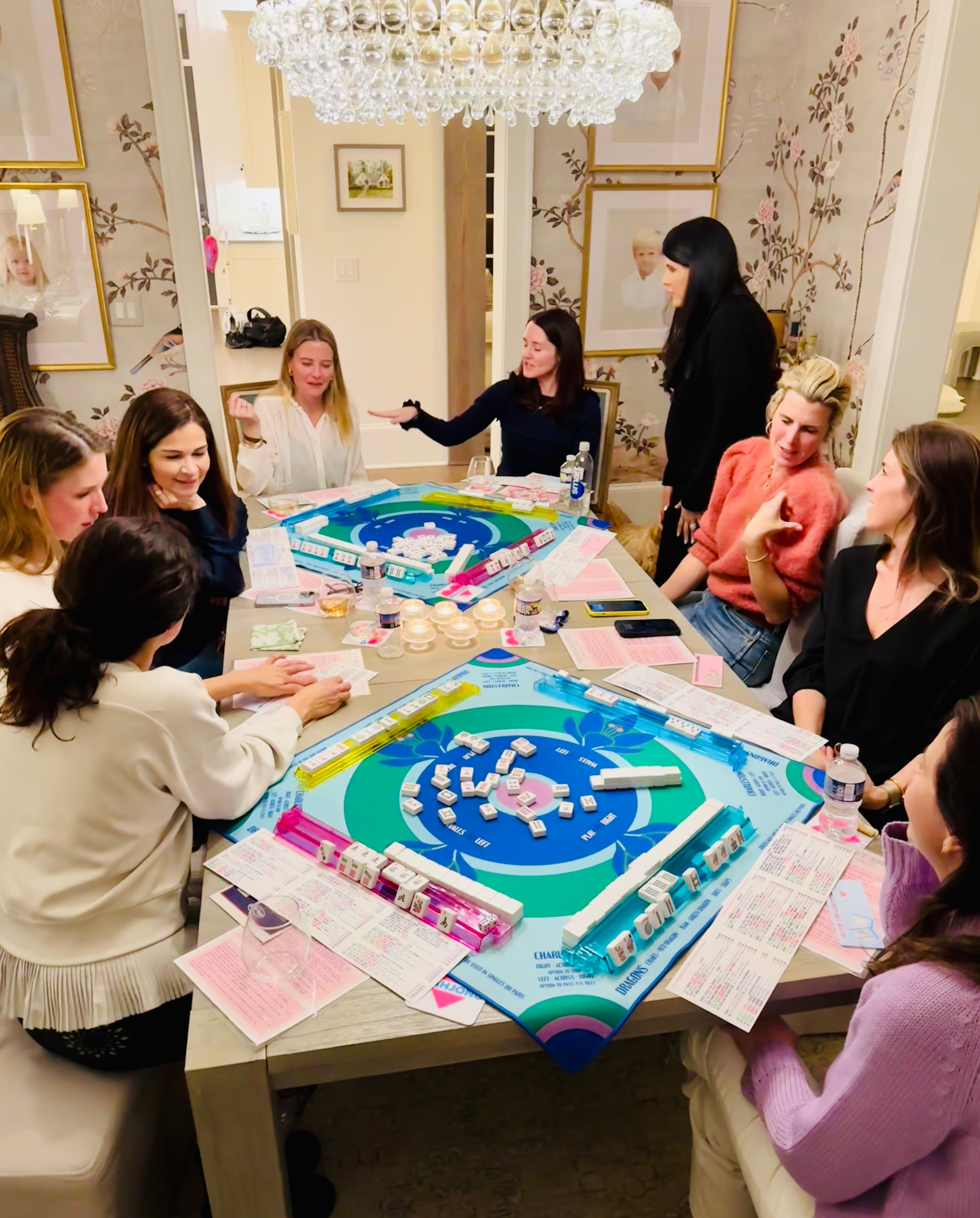 The founders of the Buckhead Mahjong Club, Liz Liu (top right) and Luci Holbert (bottom right) and friends enjoy a game of mahjong.
(Courtesy of Buckhead Mahjong Club)