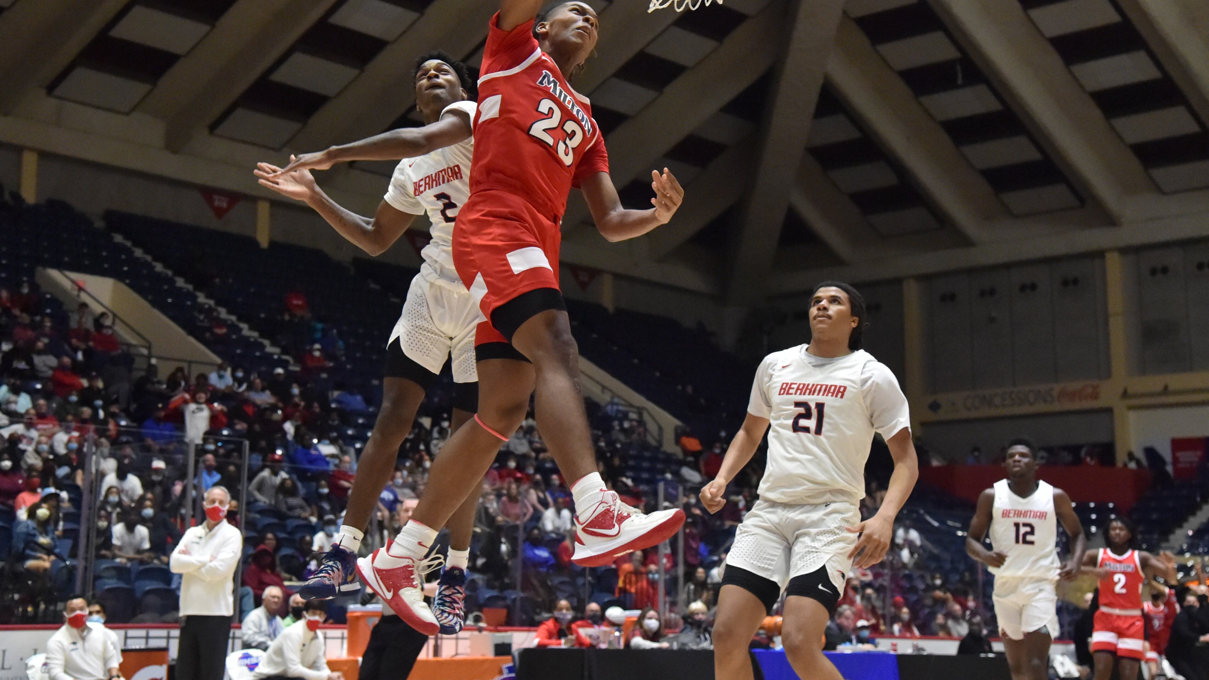 March 13, 2021 Macon - Milton's Kendall Campbell (23) gets a shot off past Berkmar's Jermahri Hill (2) during the 2021 GHSA State Basketball Class AAAAAAA Boys Championship game at the Macon Centreplex in Macon on Saturday, March 13, 2021 Milton won 52-47 over Berkmar. (Hyosub Shin / Hyosub.Shin@ajc.com)