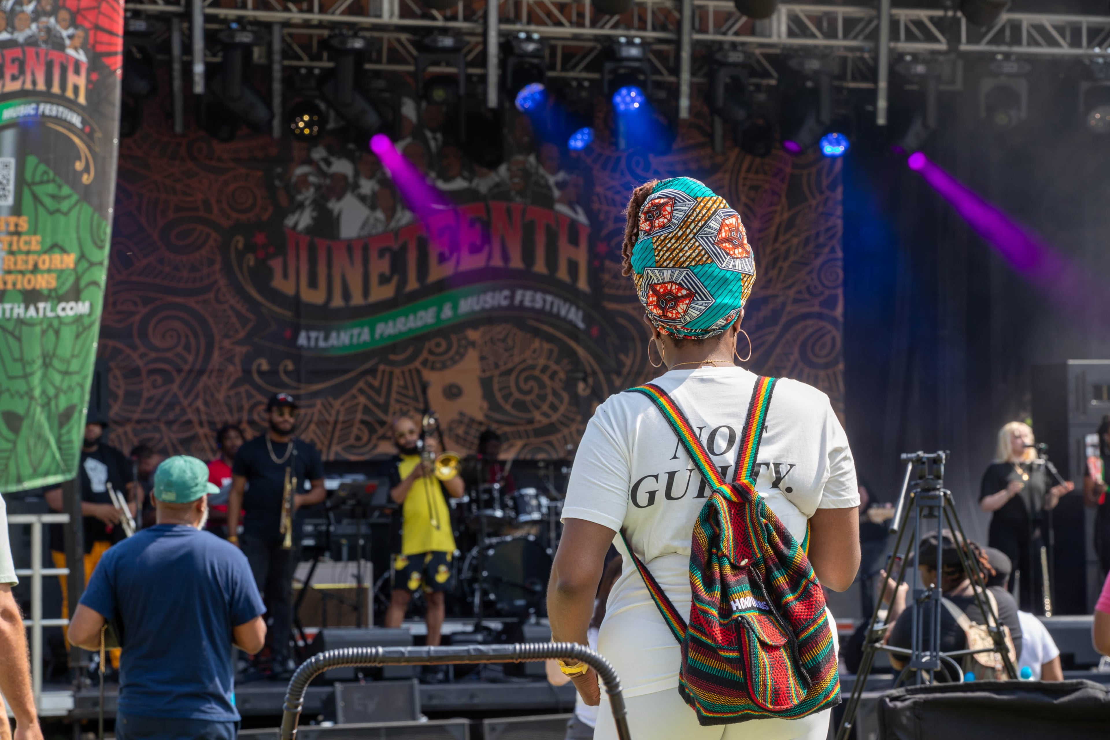 A person observes and listens to music at the Juneteenth Parade and Music Festival in Atlanta on Saturday, June 17, 2023. (Katelyn Myrick/katelyn.myrick@ajc.com)