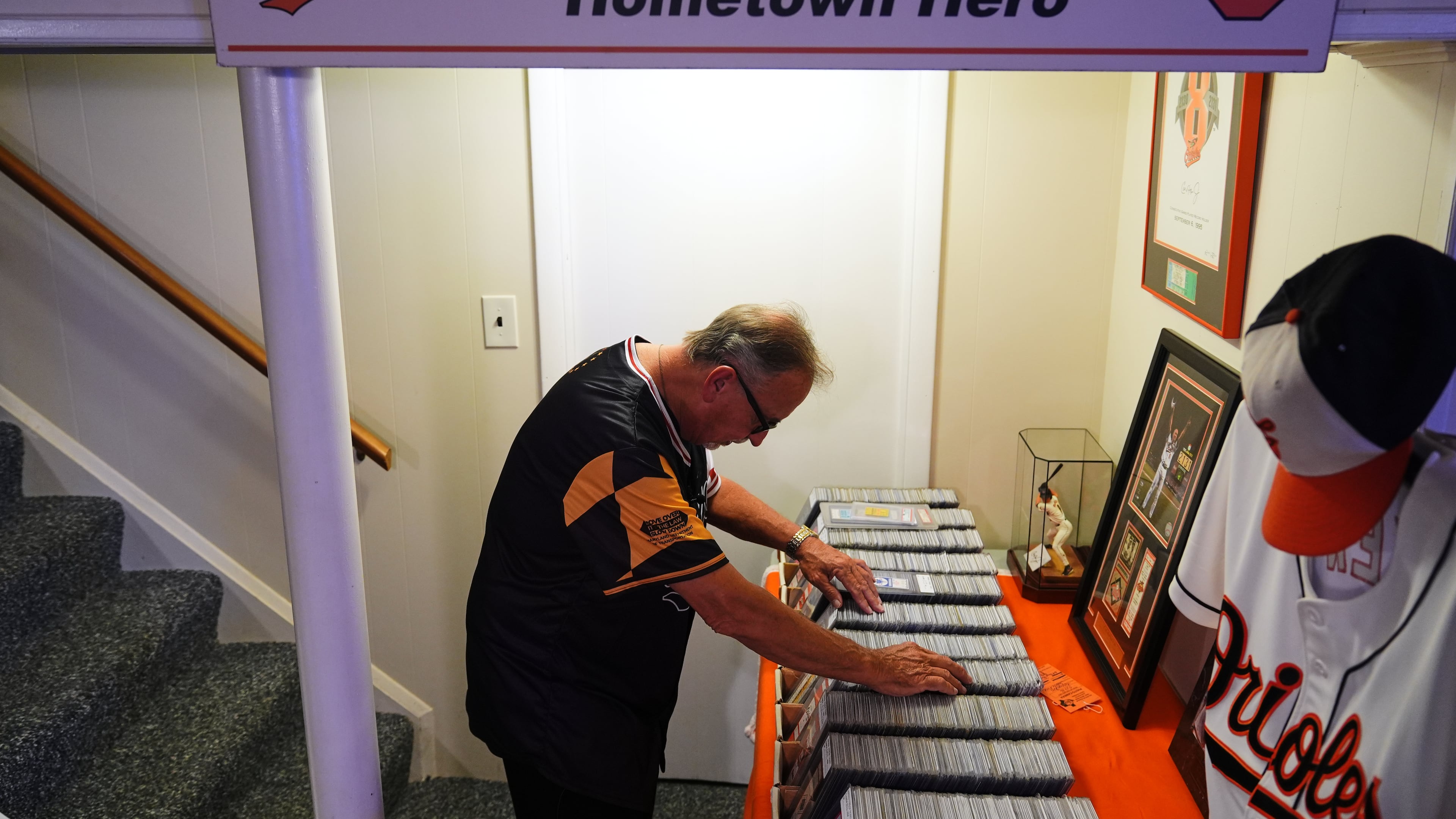 Baltimore Orioles fan Rick Taylor looks through his collection of tickets from almost every baseball game of Cal Ripken Jr.'s 2,632 game "Iron Man" streak, at his home in Reisterstown, Md., Tuesday, Oct. 13, 2026. (AP Photo/Stephanie Scarbrough)