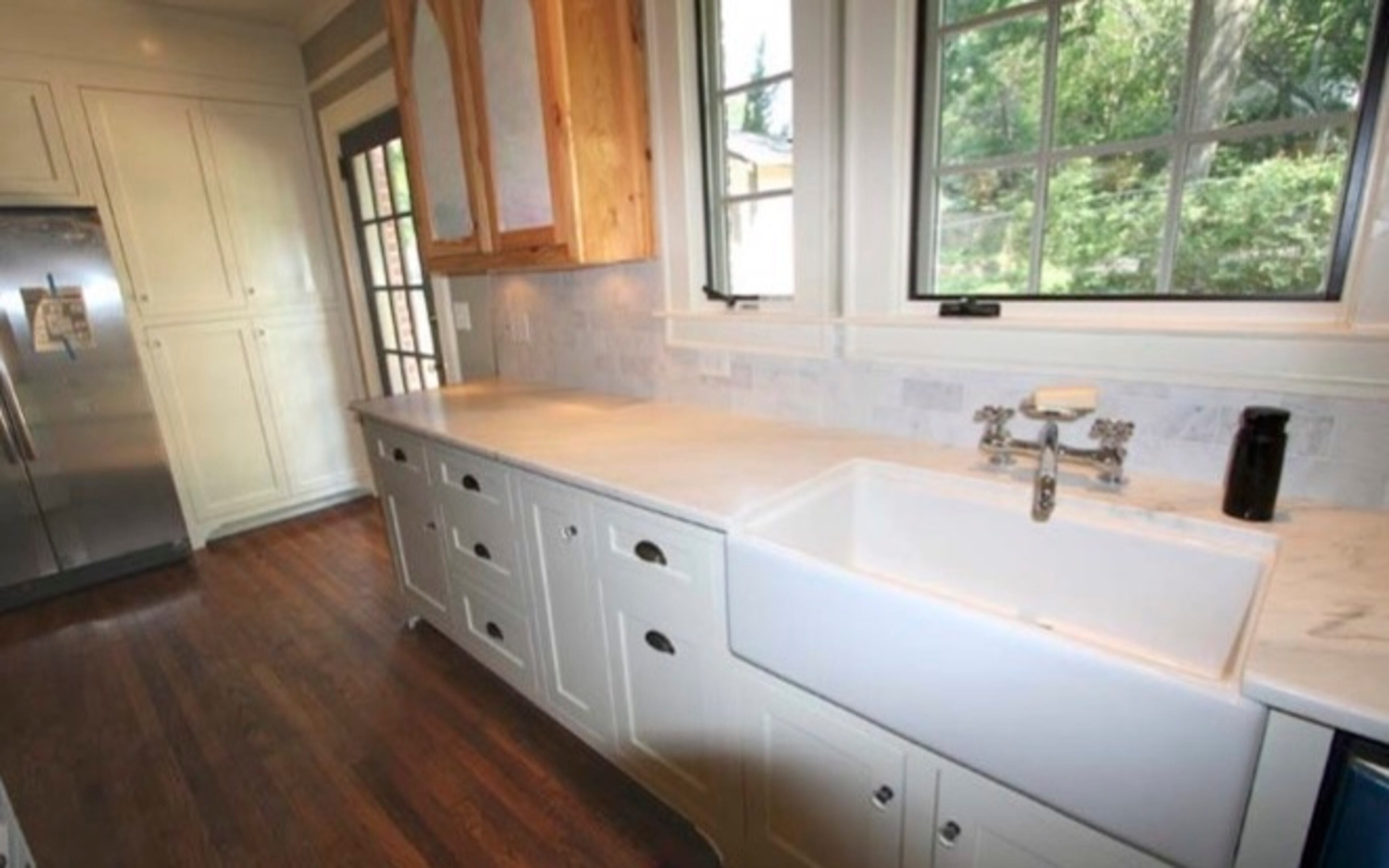 This dream kitchen was custom crafted to fit the 1930's Tudor theme.
