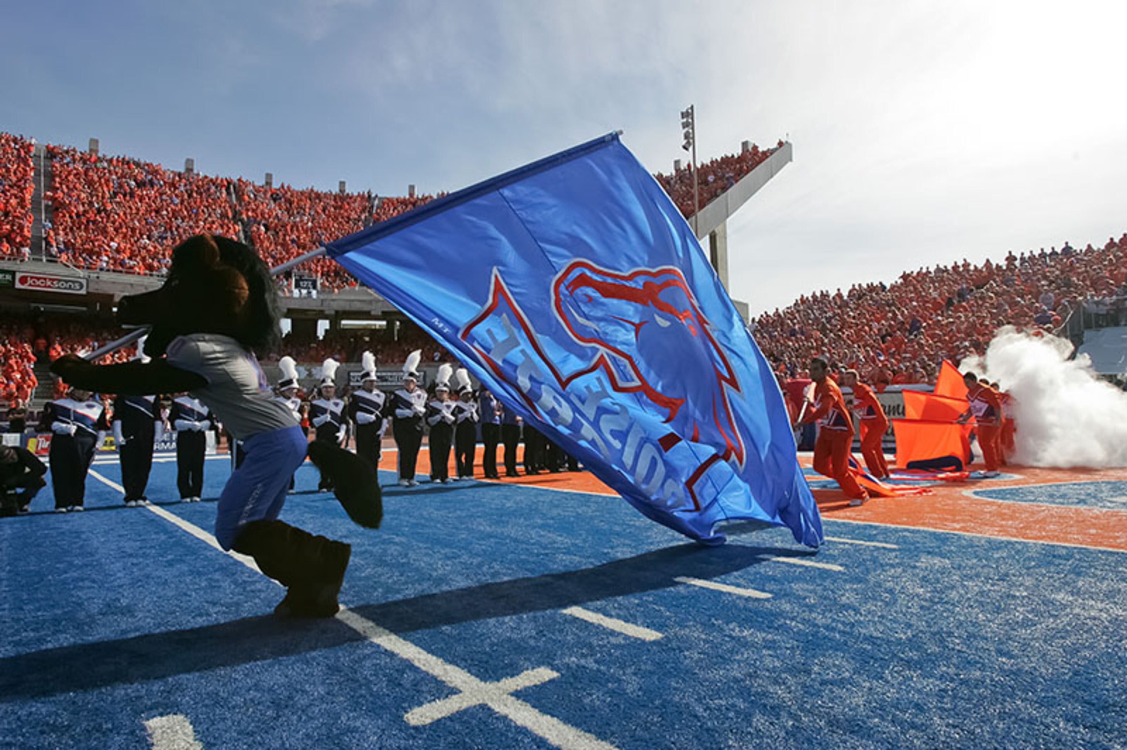 Mascot Buster Bronco of the Boise State Broncos runs the flag onto the field before the game against the Air Force Falcons at Bronco Stadium on Oct. 22, 2011 in Boise, Idaho.
