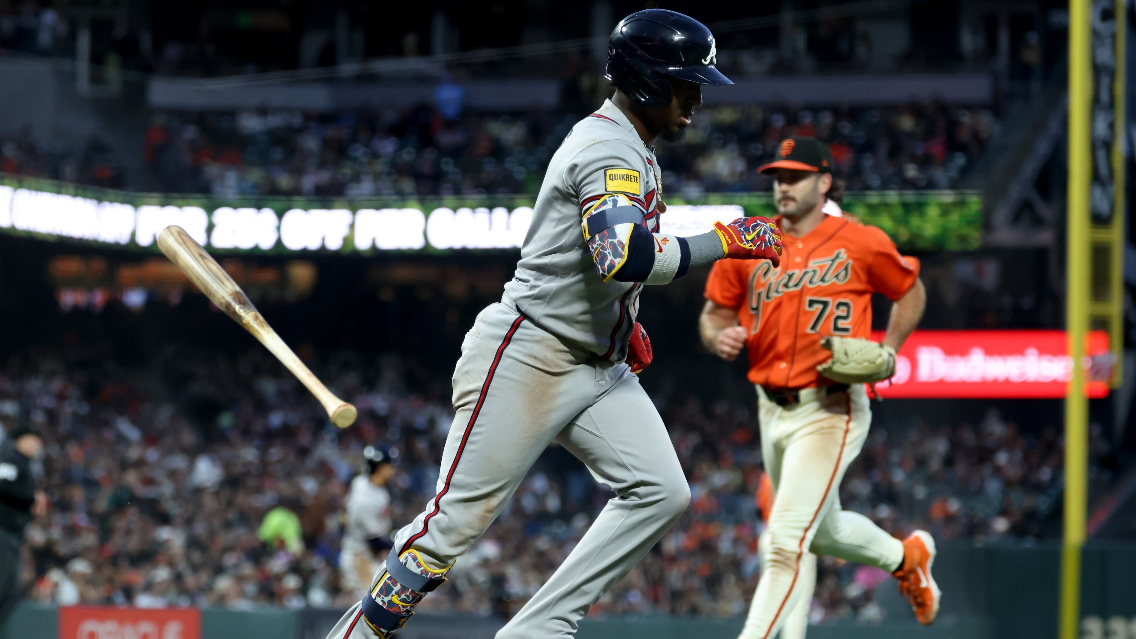 Atlanta Braves' Ozzie Albies runs to first after hitting an RBI sacrifice fly in front of San Francisco Giants pitcher Trevor McDonald on June 26, 2026. (Jed Jacobsohn/AP)