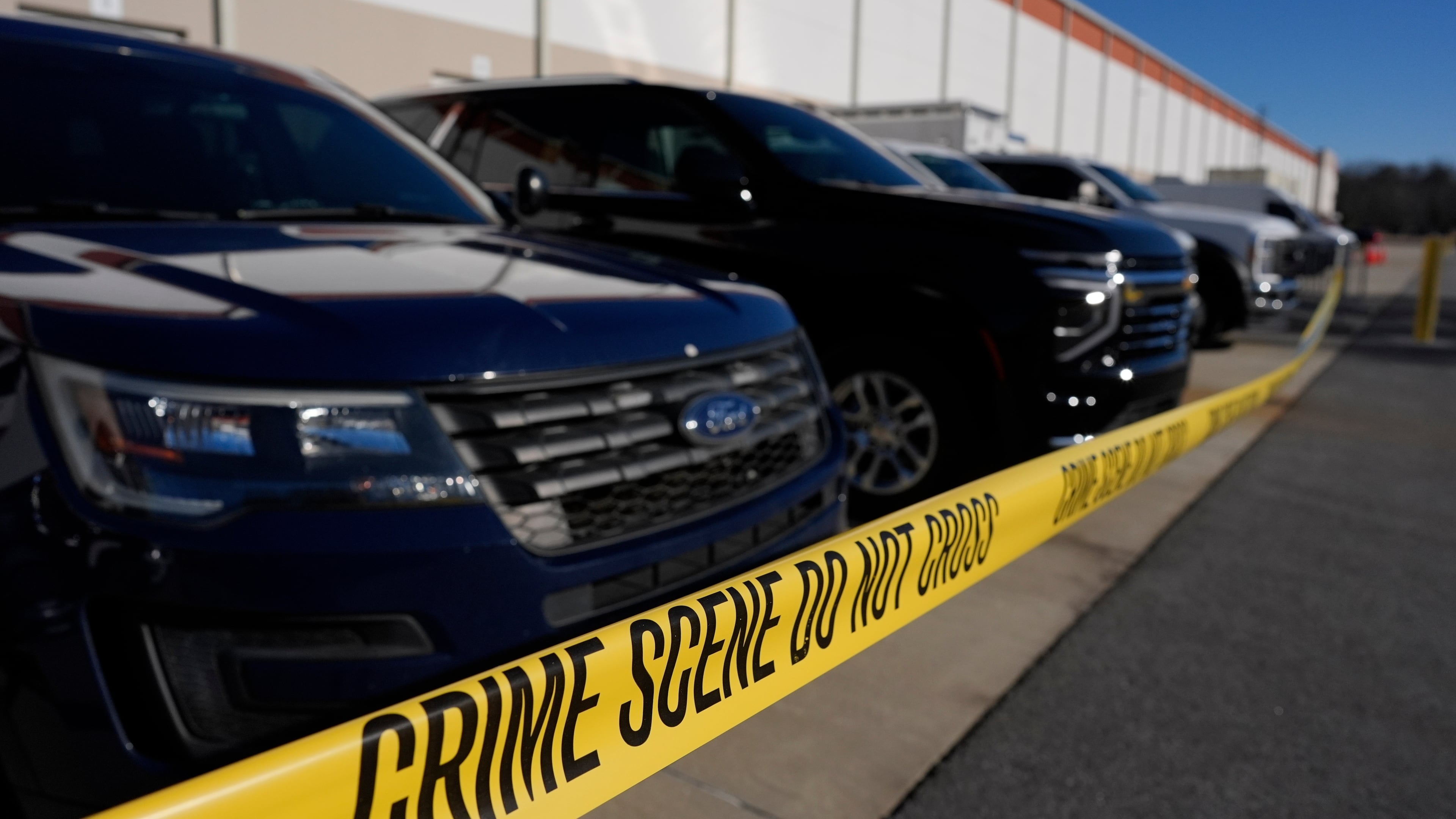 FILE - Crime scene tape is seen as FBI agents search at the Fulton County Election Hub and Operation Center, Jan. 28, 2026, in Union City, Ga., near Atlanta. (AP Photo/Mike Stewart, File)