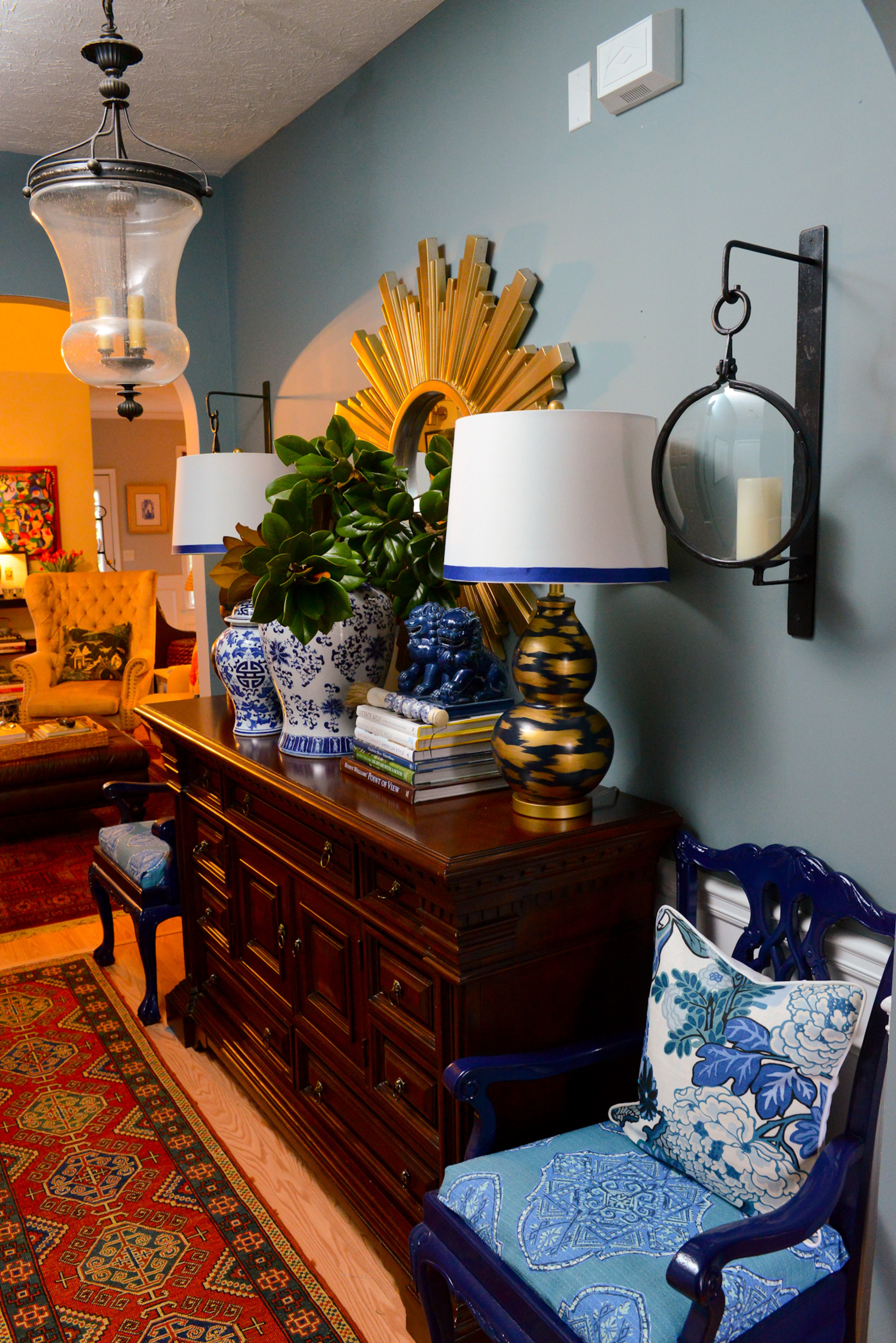 A vintage chest and custom-painted chairs found on Craigslist grace the foyer of Travis Snyder's and Craig Cowan's home in Union City. The home was new when they moved in during 2004.