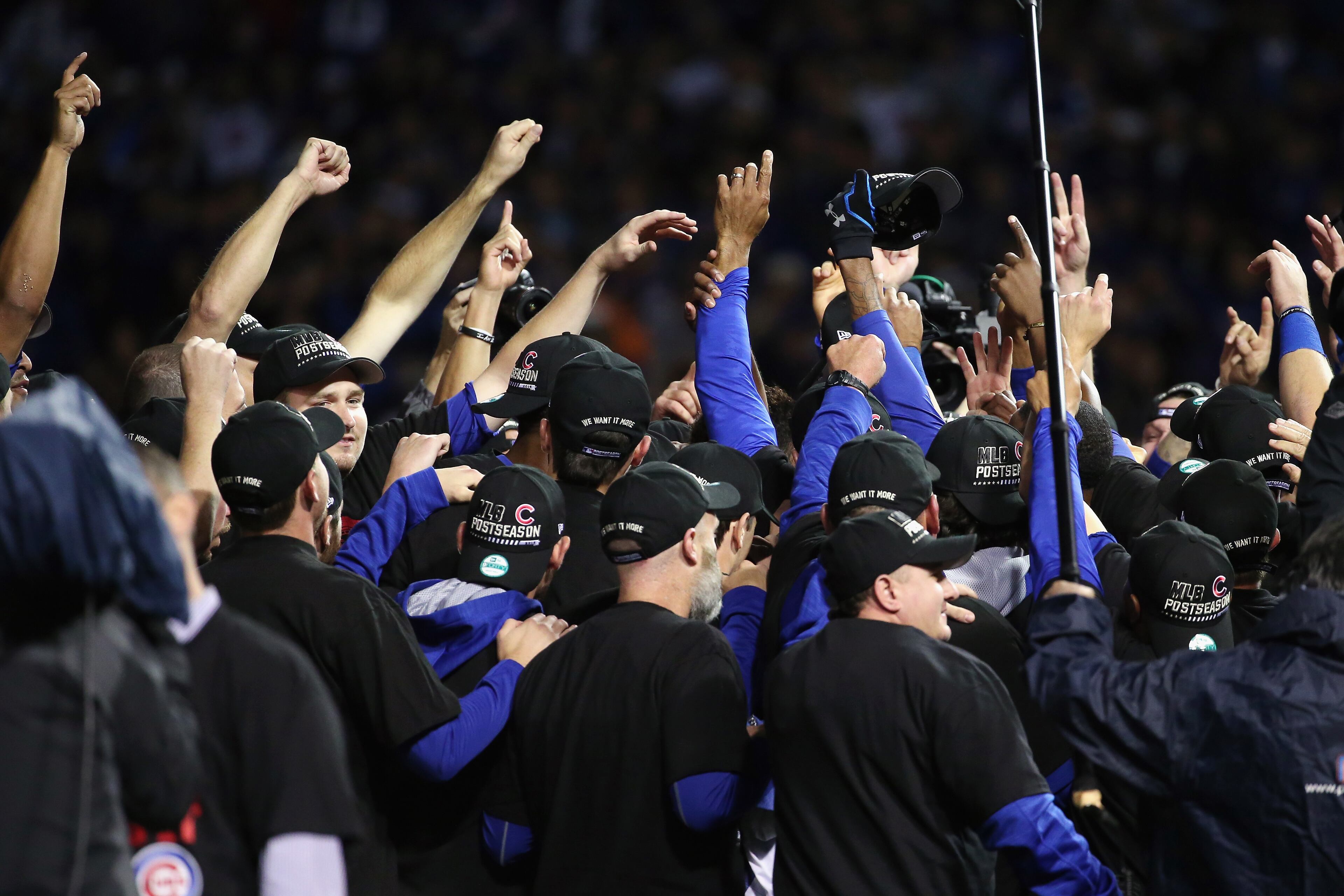 The Chicago Cubs celebrate defeating the St. Louis Cardinals 6-4 in game four of the National League Division Series at Wrigley Field on October 13, 2015 in Chicago, Illinois. (Photo by Jonathan Daniel/Getty Images)