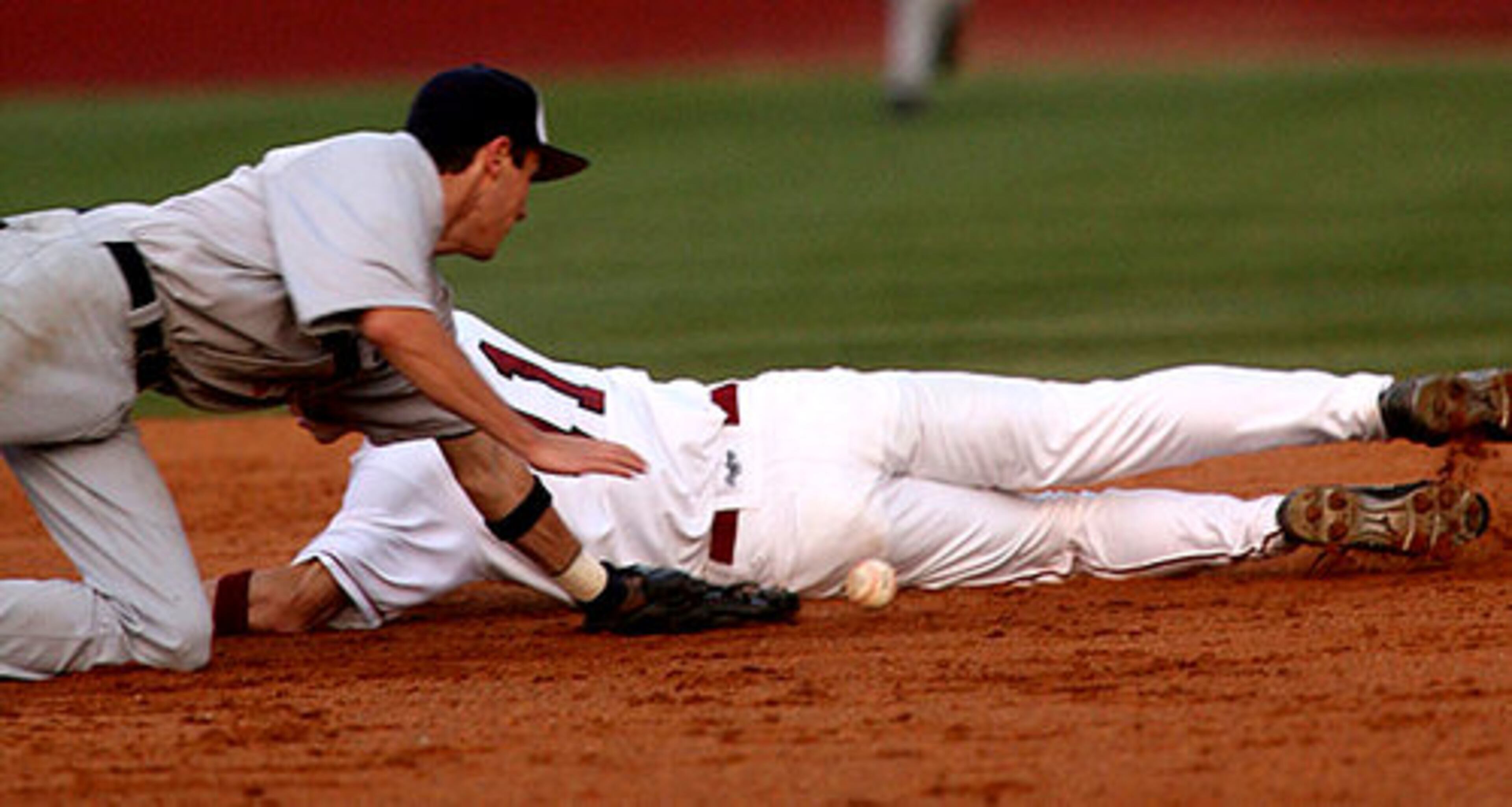 Norcross 2B Nathan Mitzel (left) loses the ball as Brookwood's Buddy Jones (1) slides into second. Jones was called out on the play.