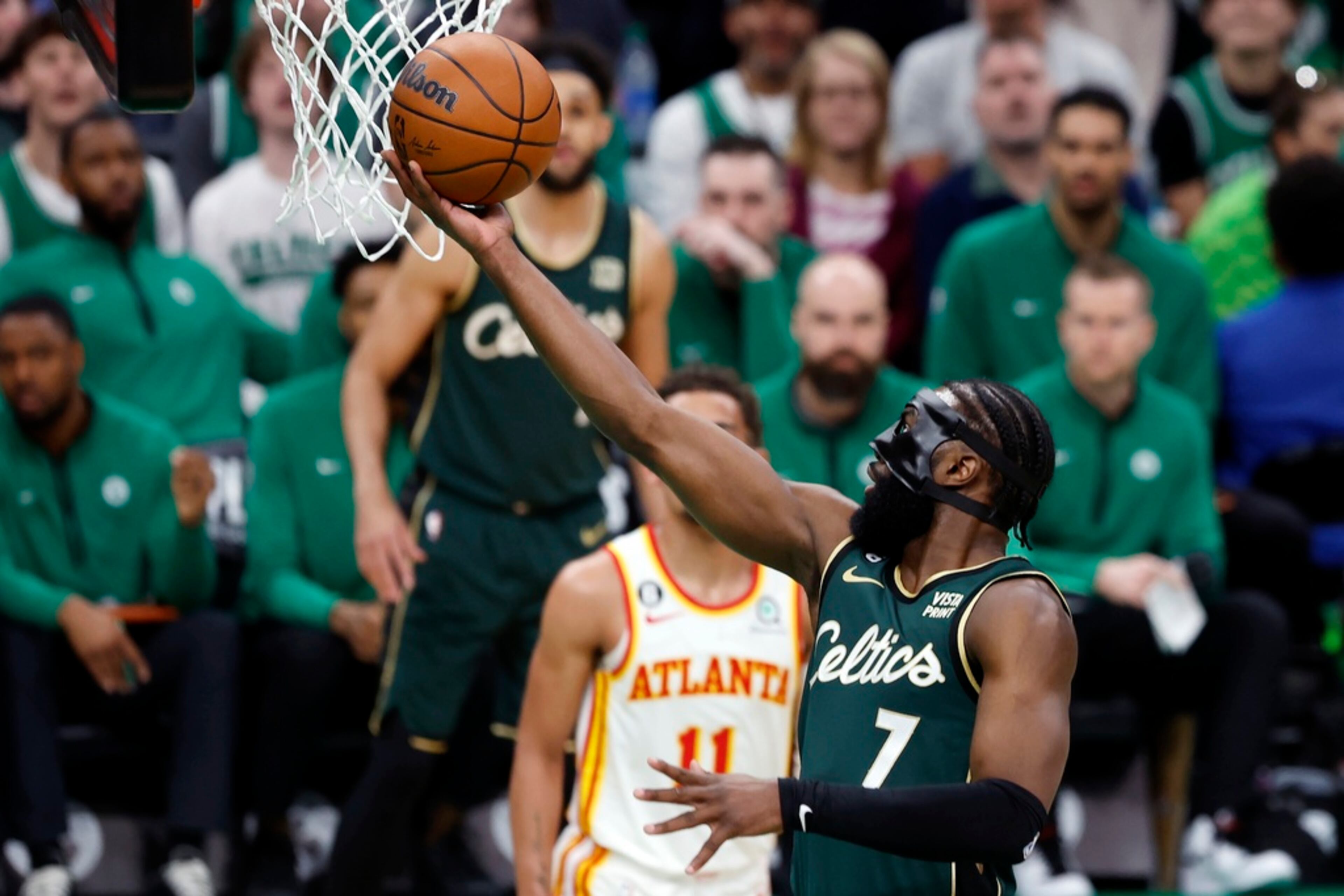 Boston Celtics' Jaylen Brown (7) shoots in front of Atlanta Hawks' Trae Young (11) in the first half during Game 1 in the first round of the NBA basketball playoffs, Saturday, April 15, 2023, in Boston. (AP Photo/Michael Dwyer)