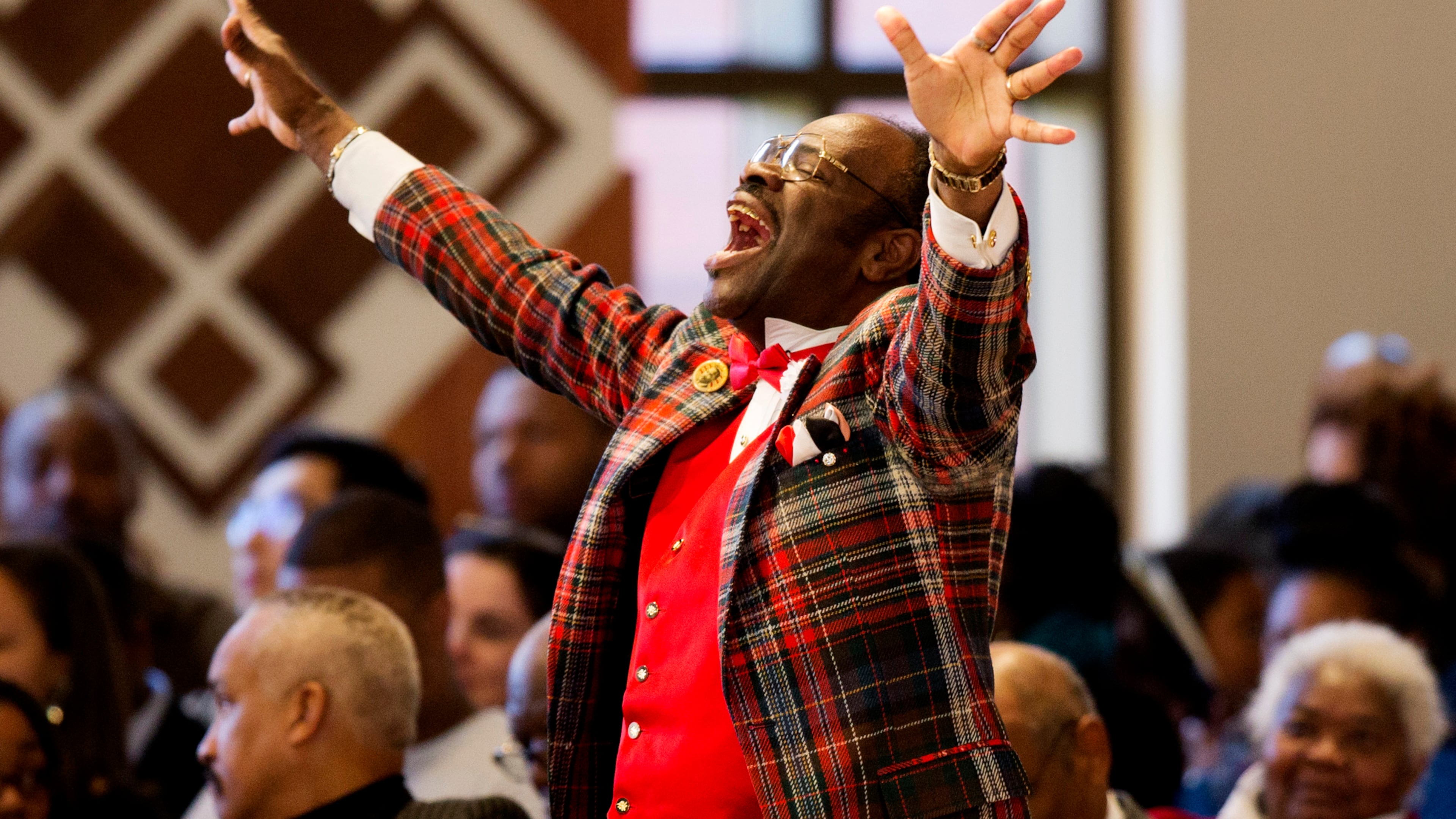 Cal Merrell, otherwise known as "The Happy Preacher" and whose last name was sometimes spelled Murrell by others, shouts out during during the Rev. Martin Luther King Jr. holiday commemorative service at Ebenezer Baptist Church where King preached, Monday, Jan. 18, 2016, in Atlanta. (AP Photo/David Goldman)