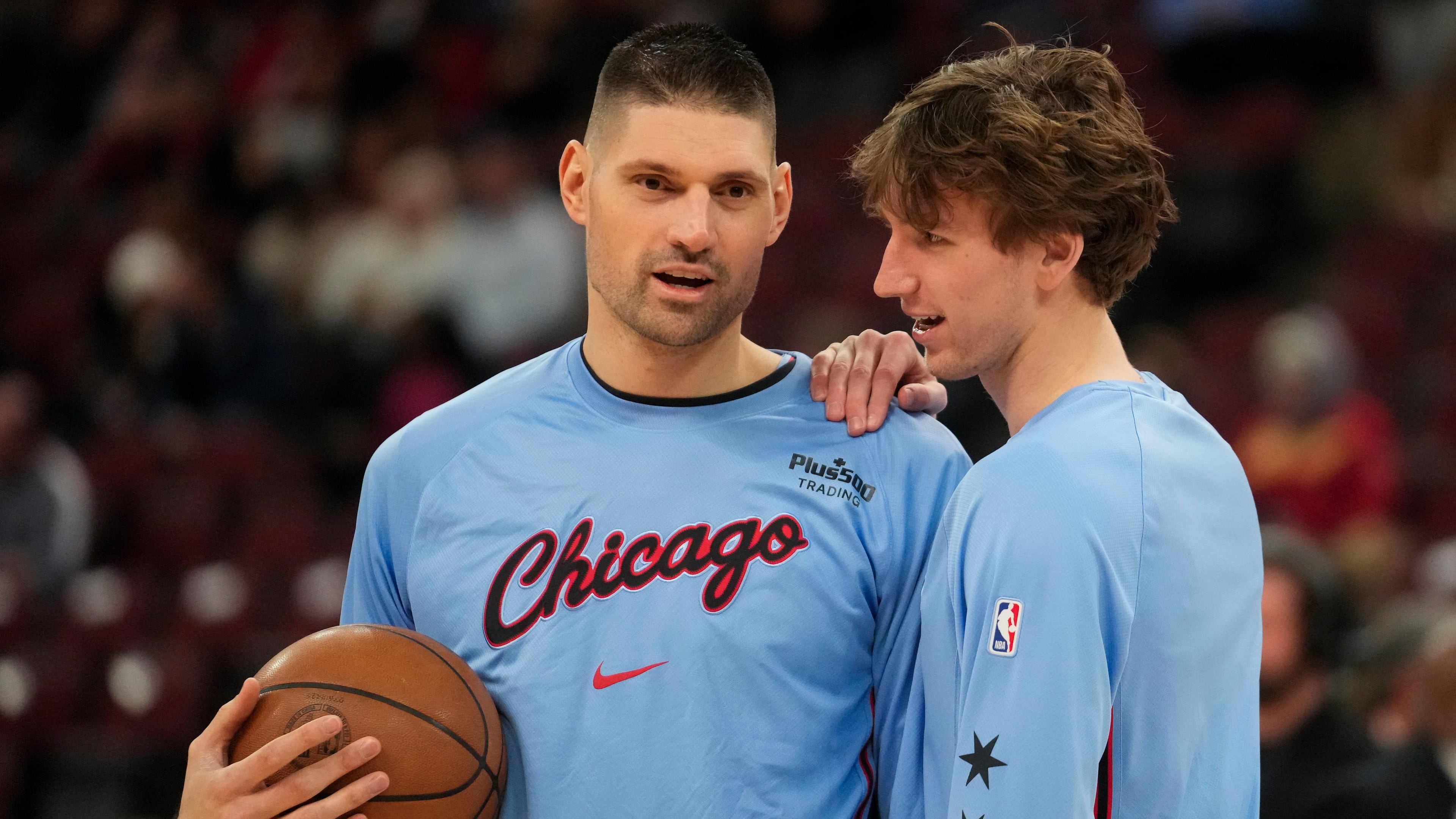 Chicago Bulls center Nikola Vucevic, left, and forward Matas Buzelis warm up before an NBA basketball game against the Miami Heat, Thursday, Jan. 29, 2026, in Chicago. (AP Photo/Erin Hooley)