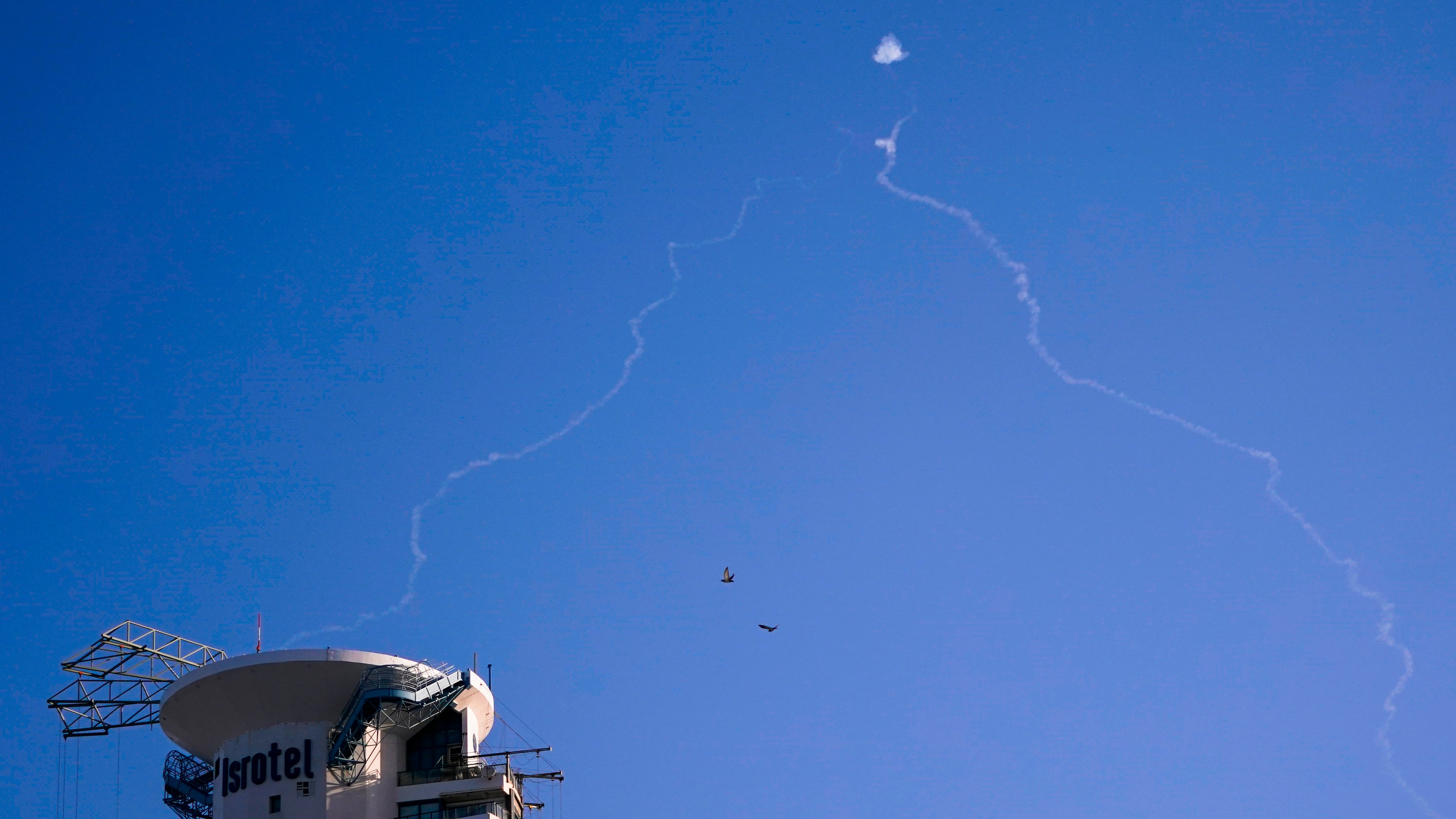 FILE - Israel's Iron Dome anti-missile system fires to intercept as air raid sirens sound in Tel Aviv, on Oct. 23, 2024. (Nathan Howard/Pool Photo via AP, File)
