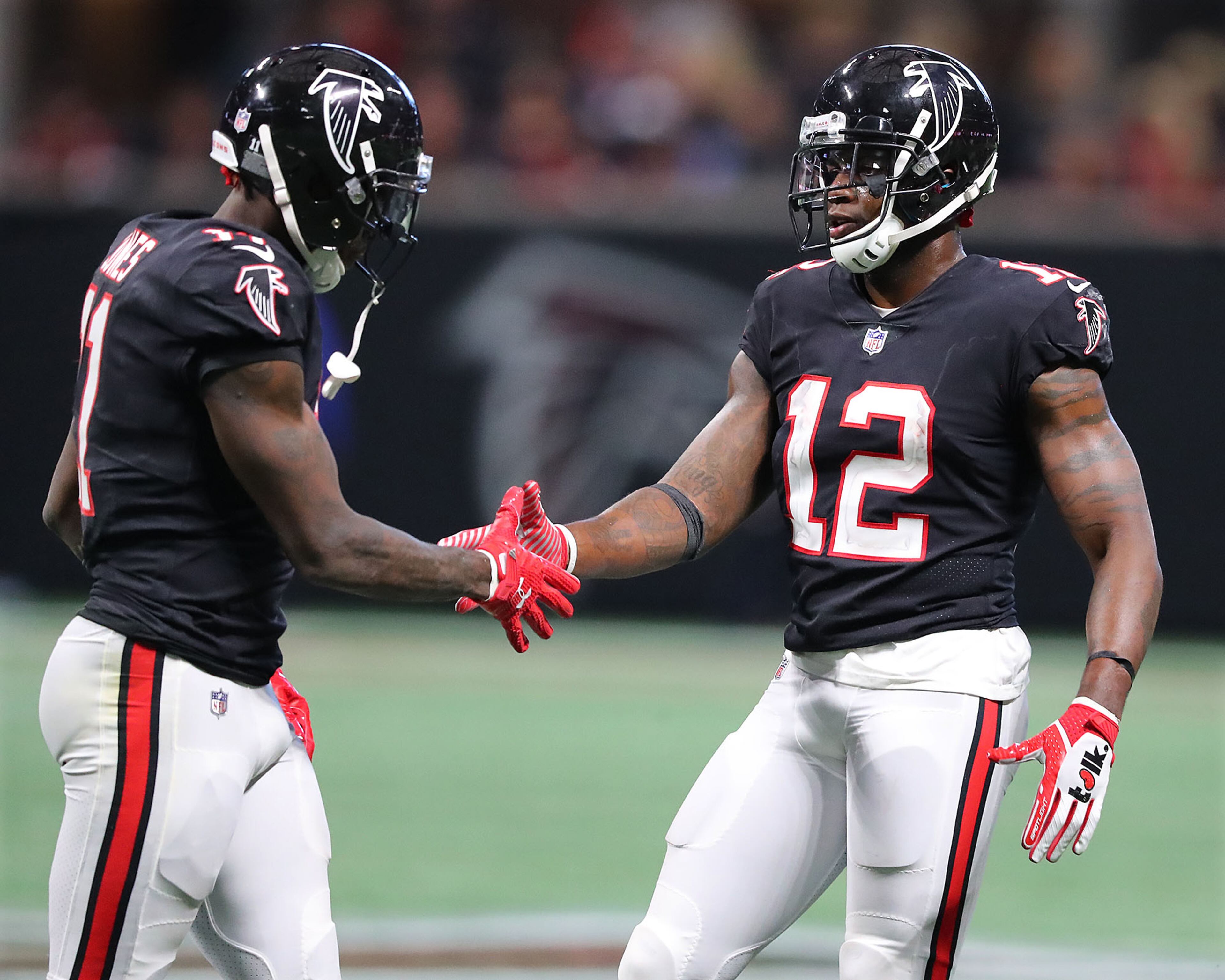 November 26, 2017 Atlanta: Falcons wide receivers Julio Jones and Mohamed Sanu celebrate in the final minutes of a 34-20 victory over the Buccaneers in a NFL football game on Sunday, November 26, 2017, in Atlanta. Curtis Compton/ccompton@ajc.com