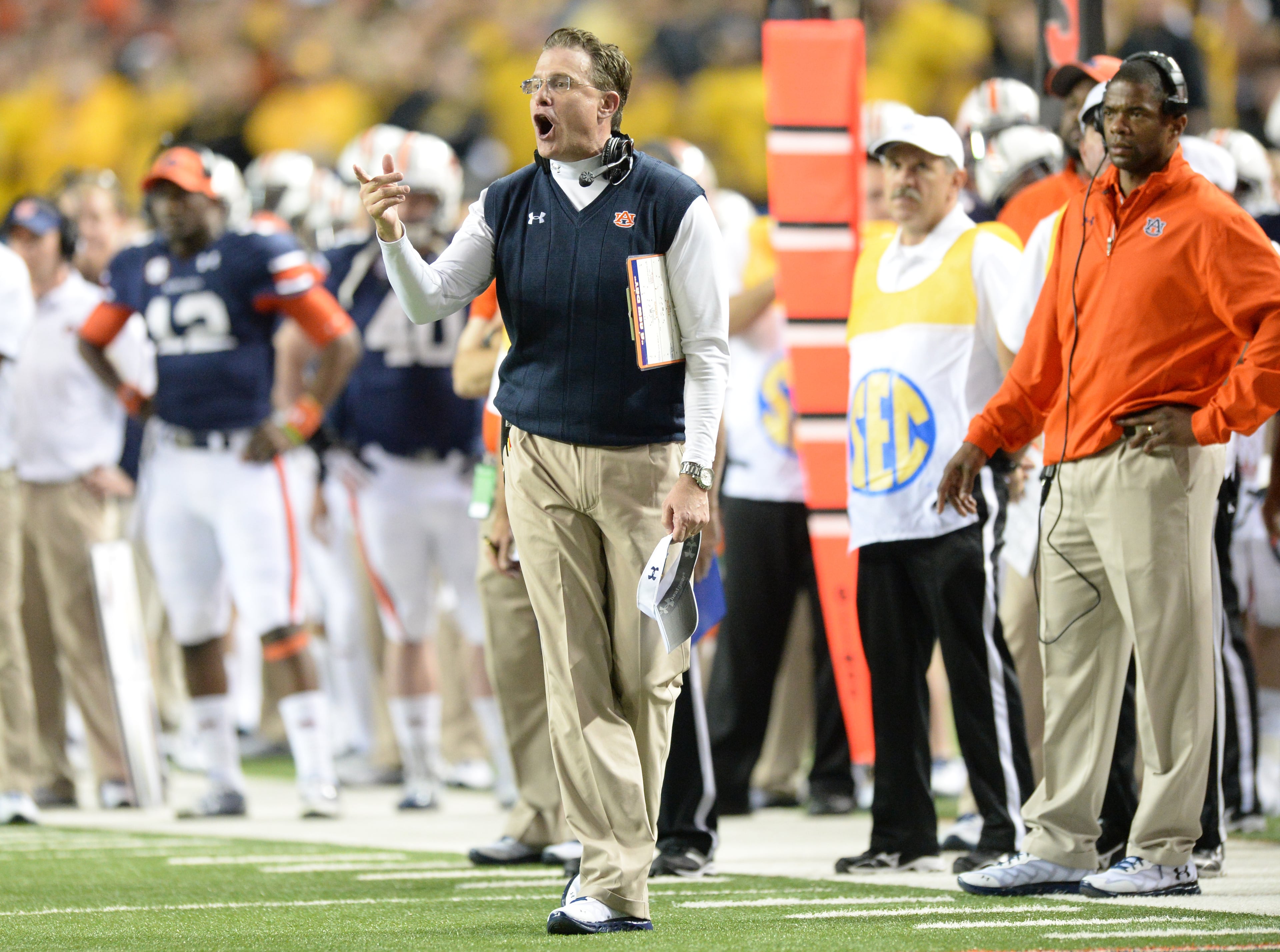 Auburn Tigers head coach Gus Malzahn shouts instructions in the second half against the Missouri Tigers during the SEC Championship game at Georgia Dome on Saturday, December 7, 2013. Auburn Tigers won 59-42. HYOSUB SHIN / HSHIN@AJC.COM