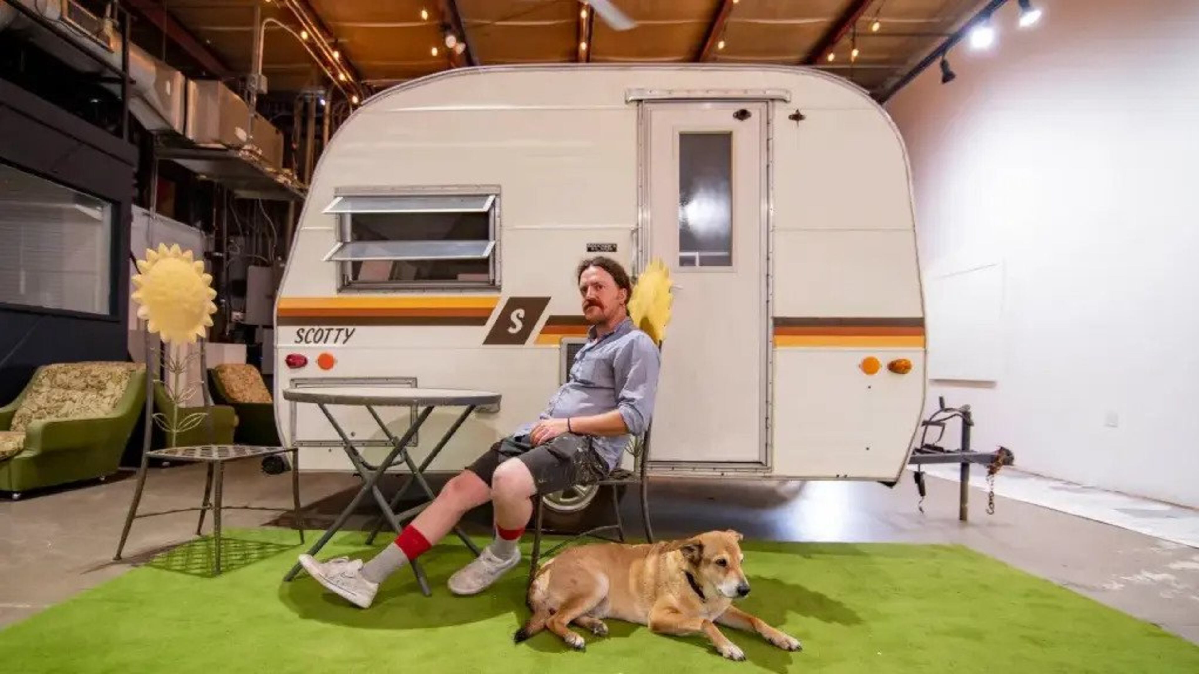 Lucas Rocheleau with his dog Ted in front of his immersive art installation. (Photo Courtesy of Isadora Pennington)