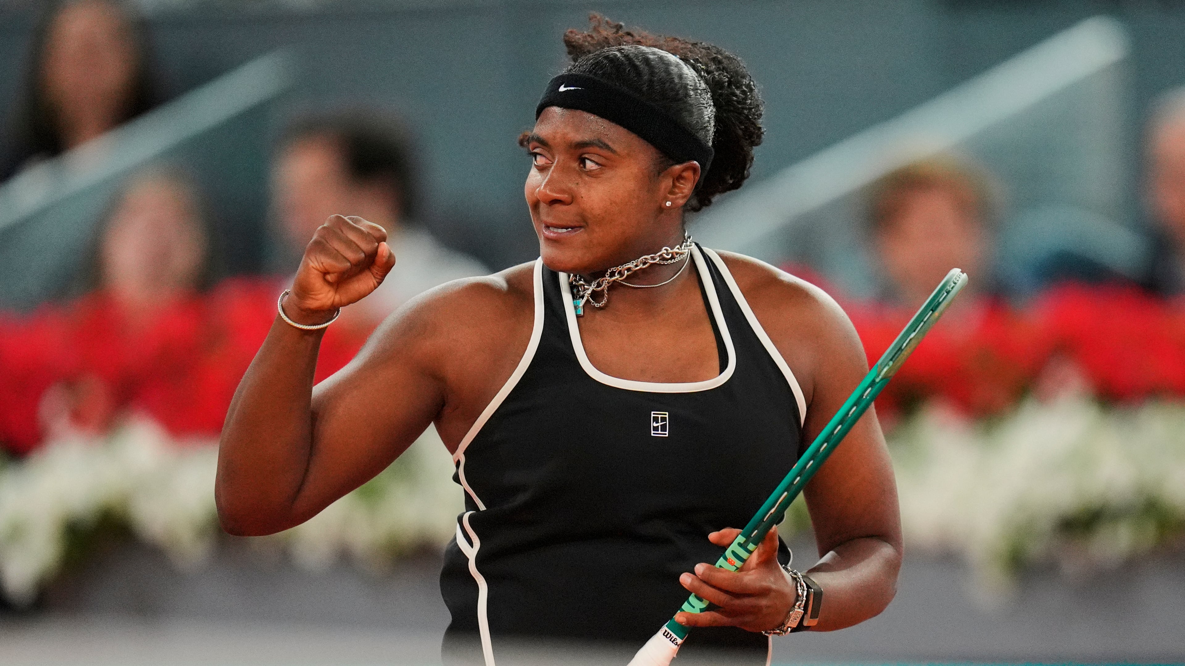Hailey Baptiste, of the United States, celebrates a point during her match against Aryna Sabalenka, of Belarus, at the Madrid Open tennis tournament in Madrid, Tuesday, April 28, 2026. (AP Photo/Manu Fernandez)