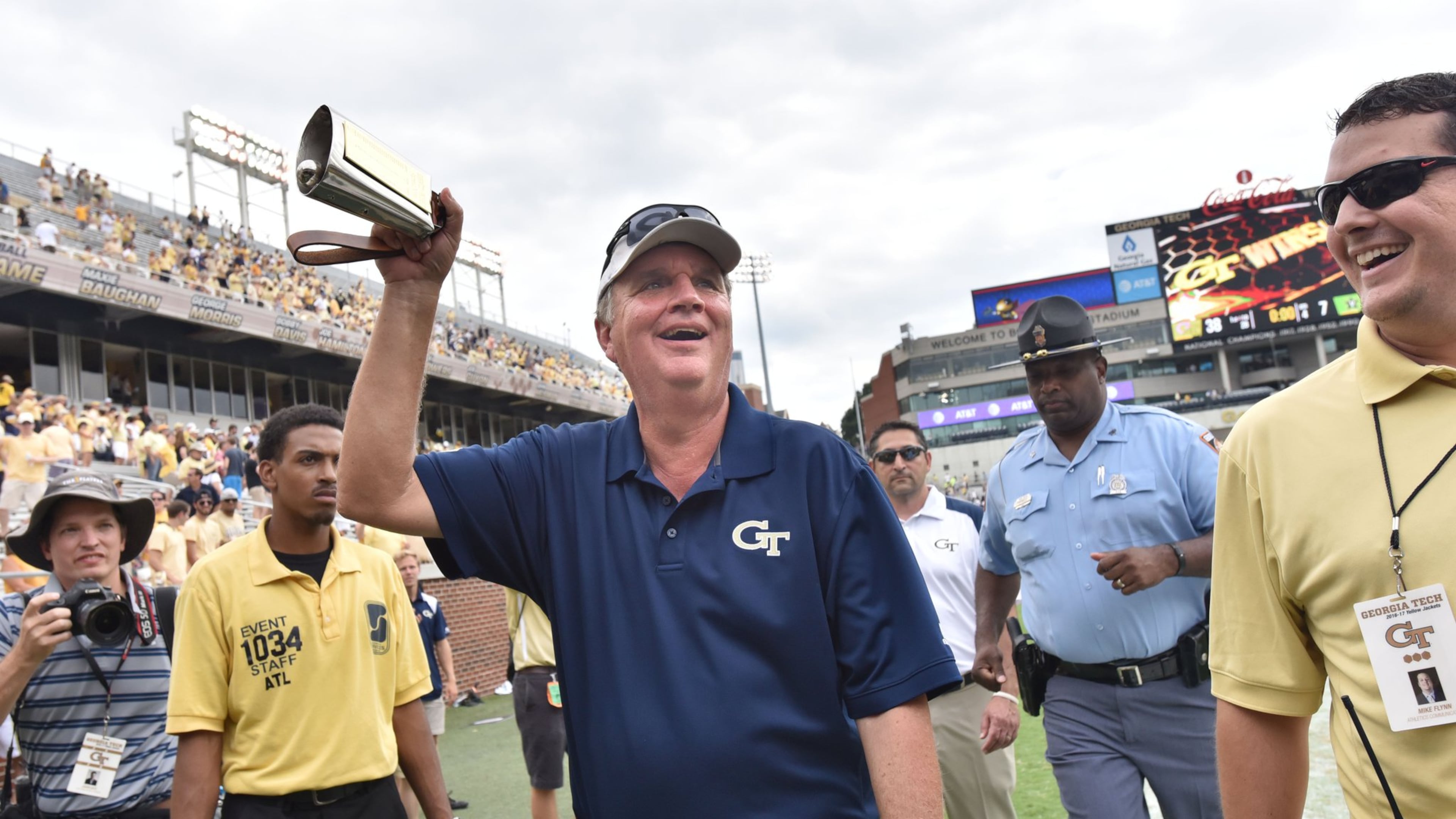 Paul Johnson rings the long-lost cowbell, marking a victory over Vanderbilt Saturday. (Hyosub Shin/hshin@ajc.com)