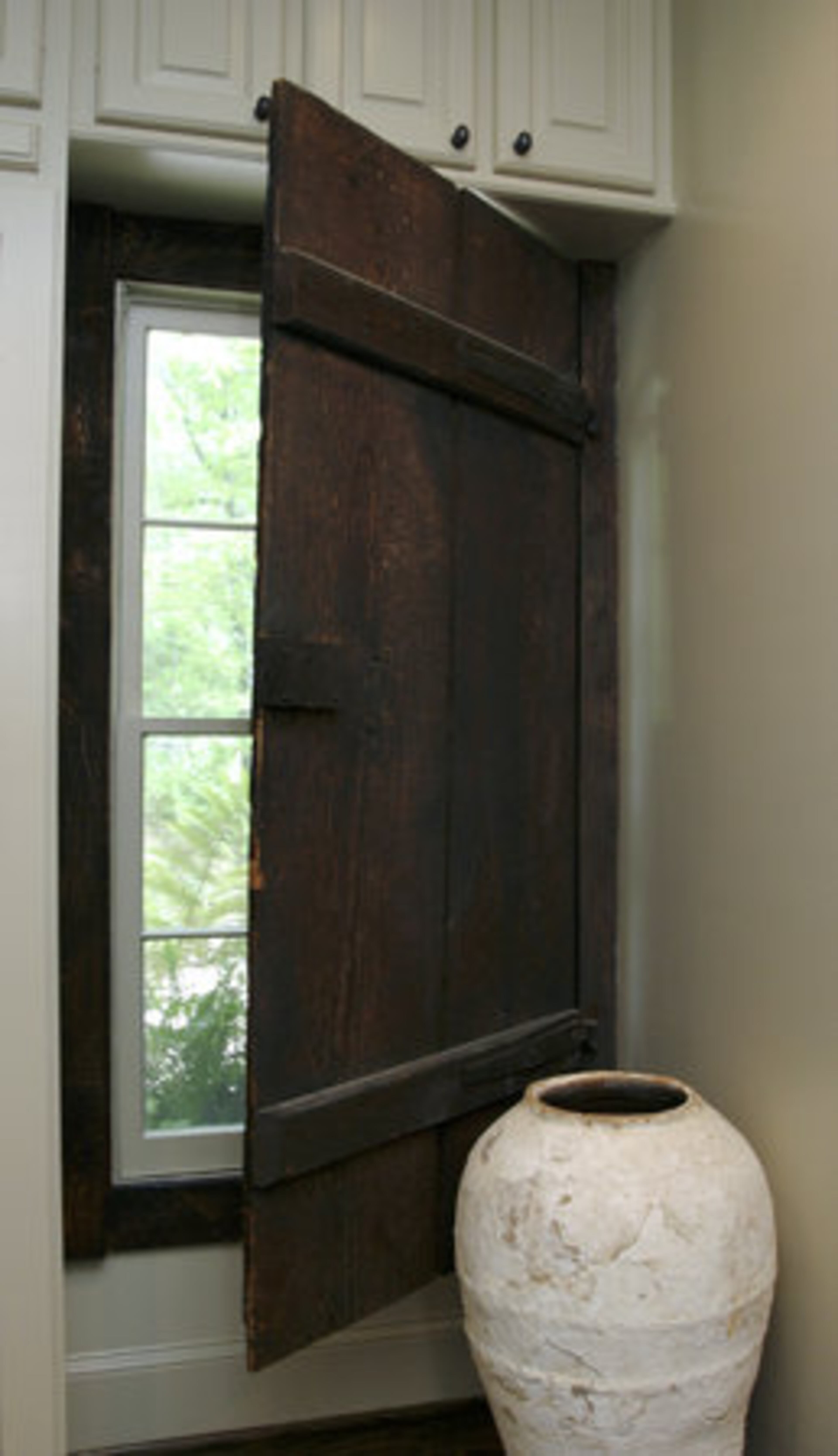Mary dates the door on the window in the kitchen as being from the 1400s. "One of my contractors said it would make a great shutter. My style is about taking pieces, and not knowing at the time I'm buying them what I'm going to do with them, but I figure that out later with the help of a little imagination."