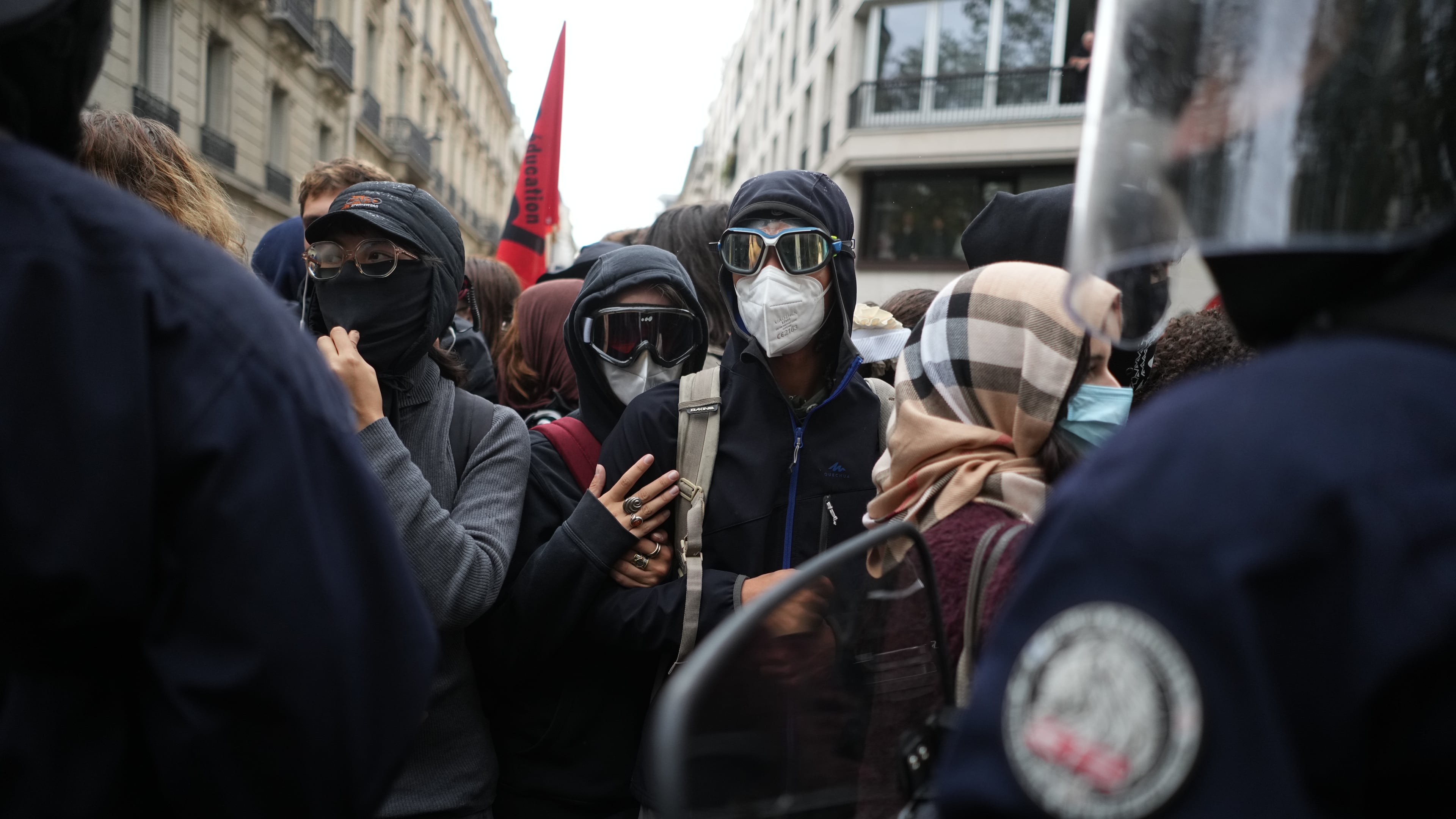 Students face policemen near Sciences Po University as they protest against under-resourced schools, in Paris, Wednesday, Oct. 7, 2026. (AP Photo/Thibault Camus)
