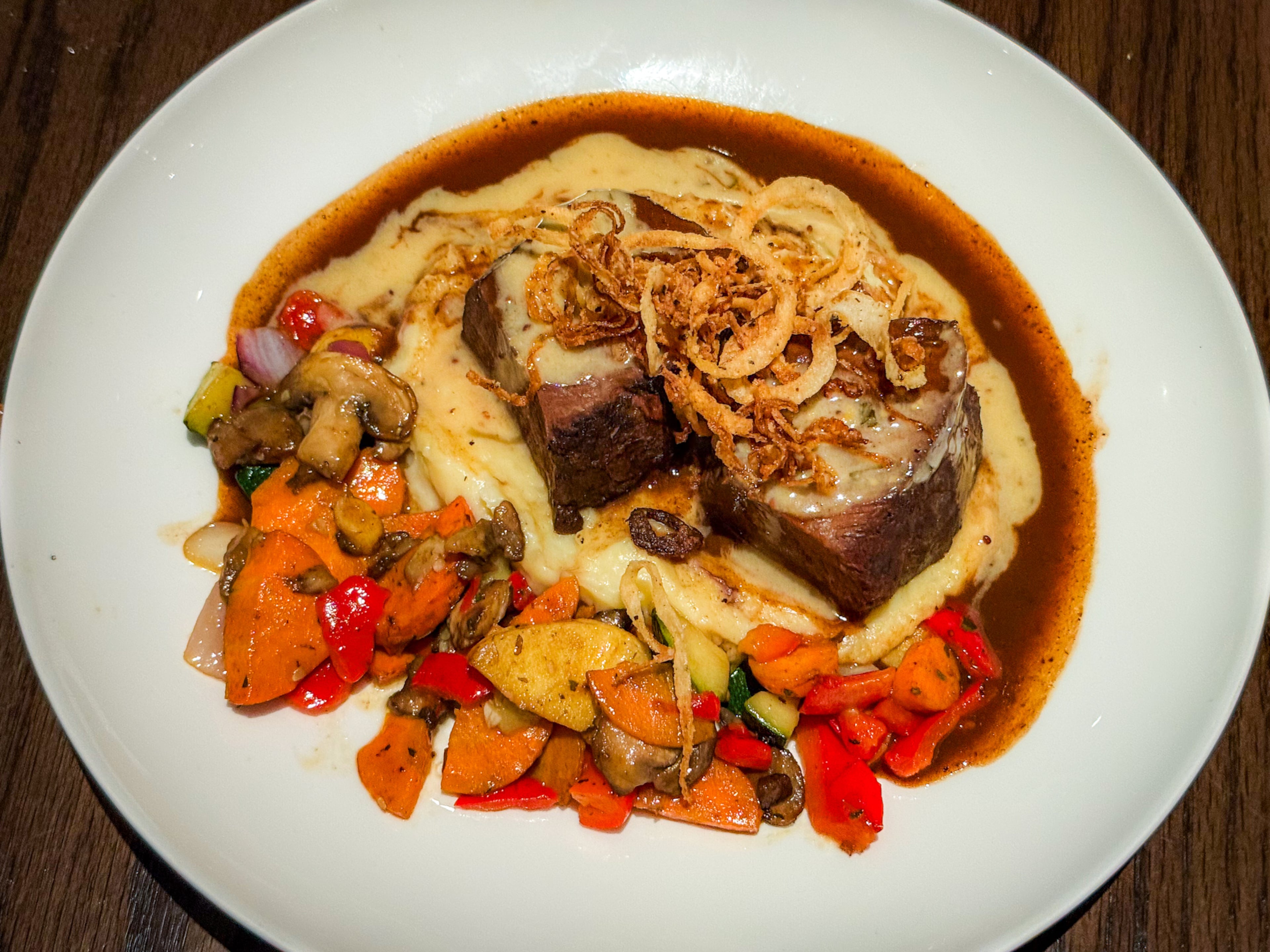 The red wine-braised short ribs dish is a solid choice while dining at Cooper's Hawk. (Henri Hollis/AJC)