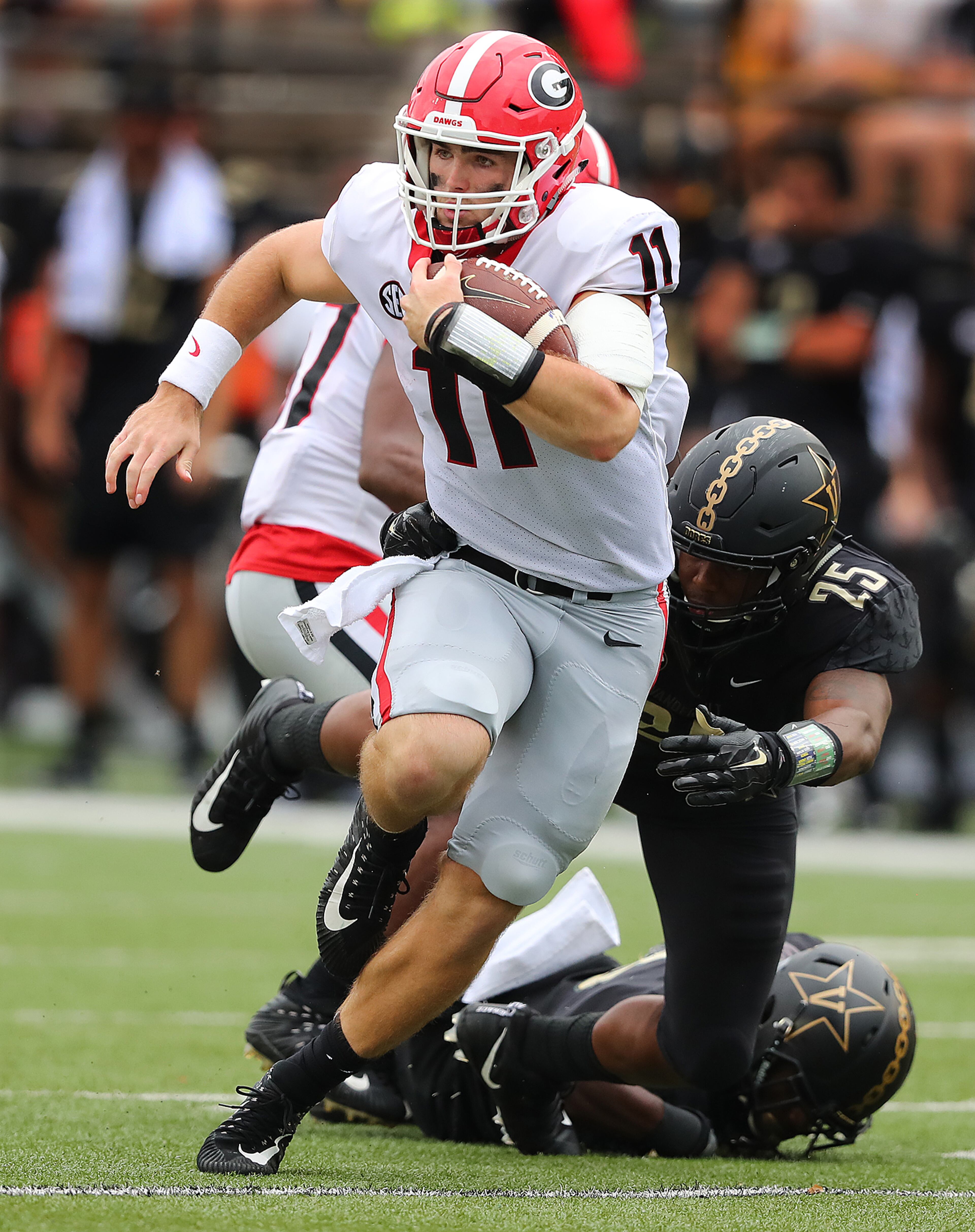 October 7, 2017 Nashville: Georgia quarterback Jake Fromm scrambles for yardage on a quarterback keeper during the second half against Vanderbilt in a NCAA college football game on Saturday, October 7, 2017, in Nashville. Curtis Compton/ccompton@ajc.com