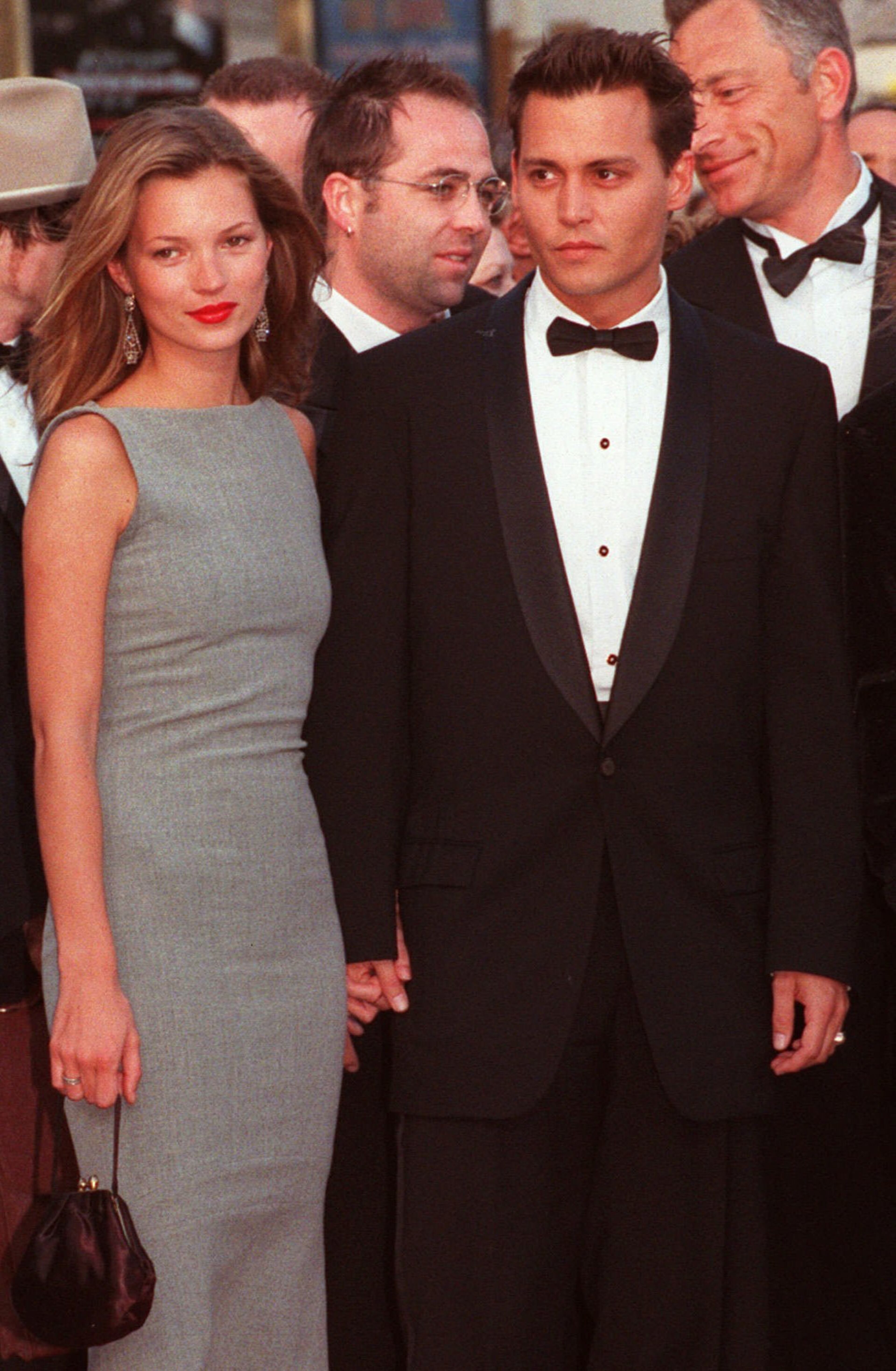 US movie star Johnny Depp arrives with British top model Kate Moss at the Festival Palace in Cannes on Saturday May 10, 1997 to attend the screening of his first movie as director "The Brave" which is presented today to the jury of the 50 International Cannes Film festival.