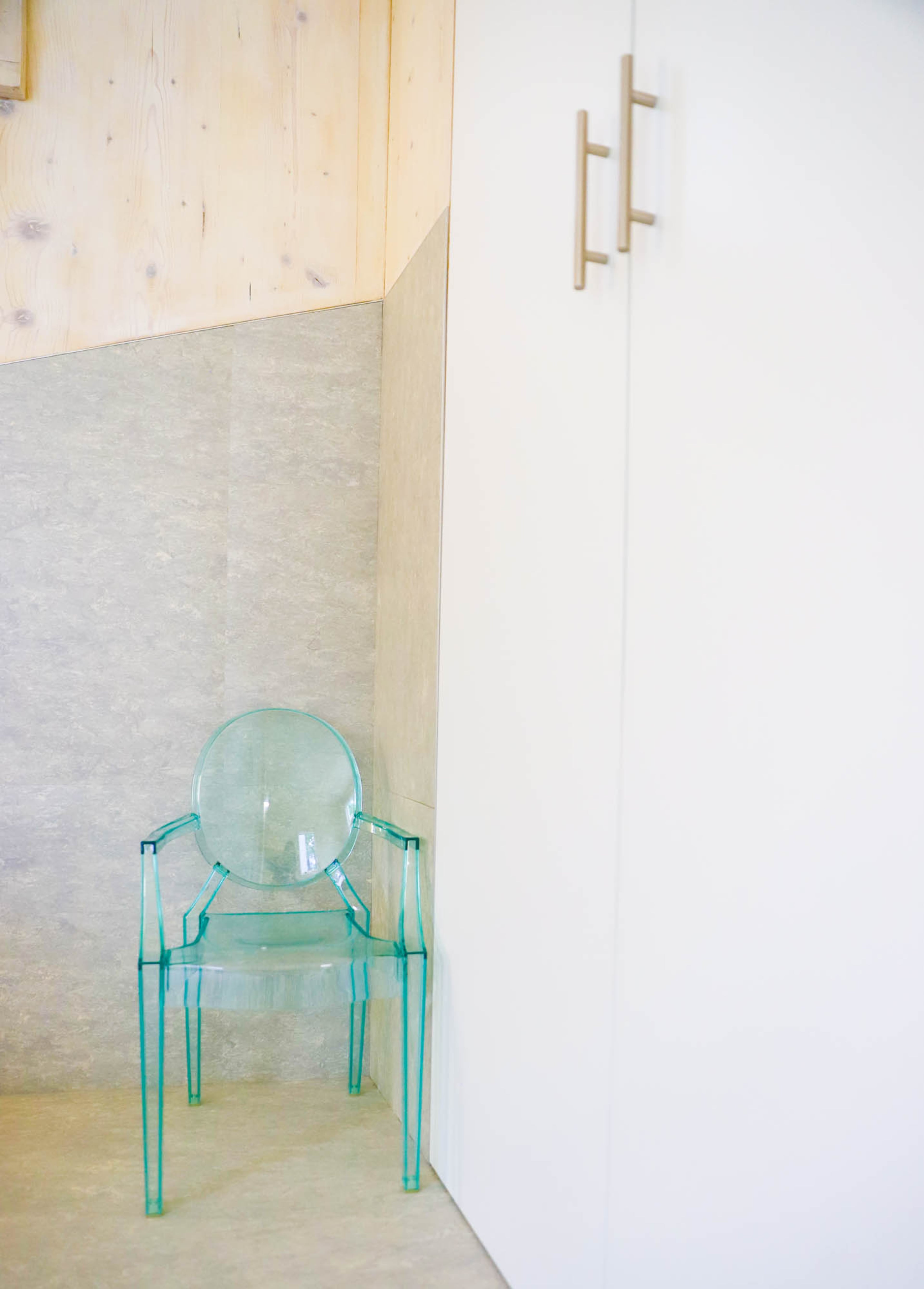 The master bedroom's floor is vinyl tile from Forbo Flooring Systems' Marmoleum Modular collection with the appearance of concrete.