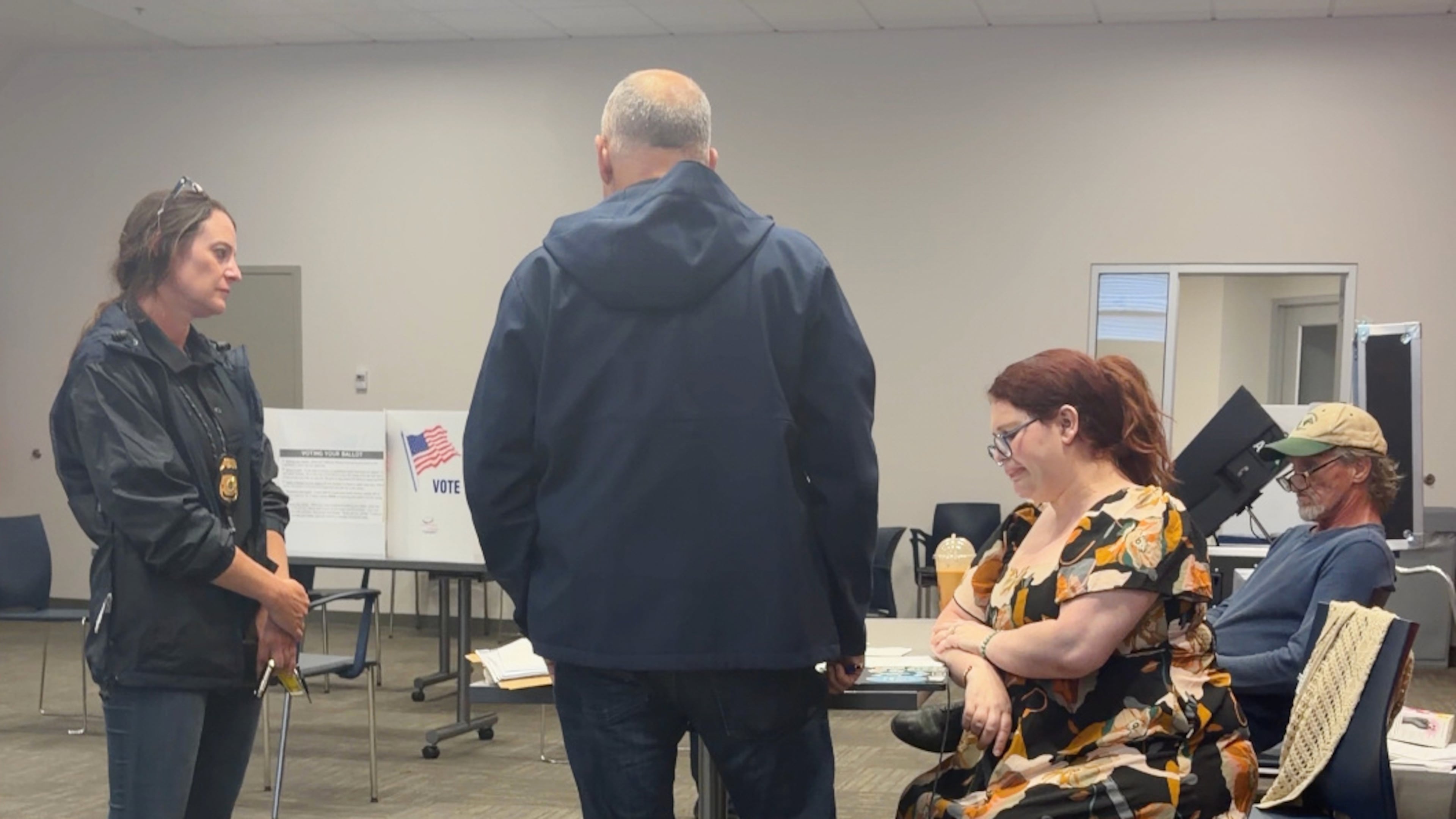 In this image from video provided by Sheilia Milledge, Paigelynne Gonyea, right, is presented with a form at a polling place on Tuesday, June 23, 2026, in Syracuse, N.Y. (Sheilia Milledge via AP)