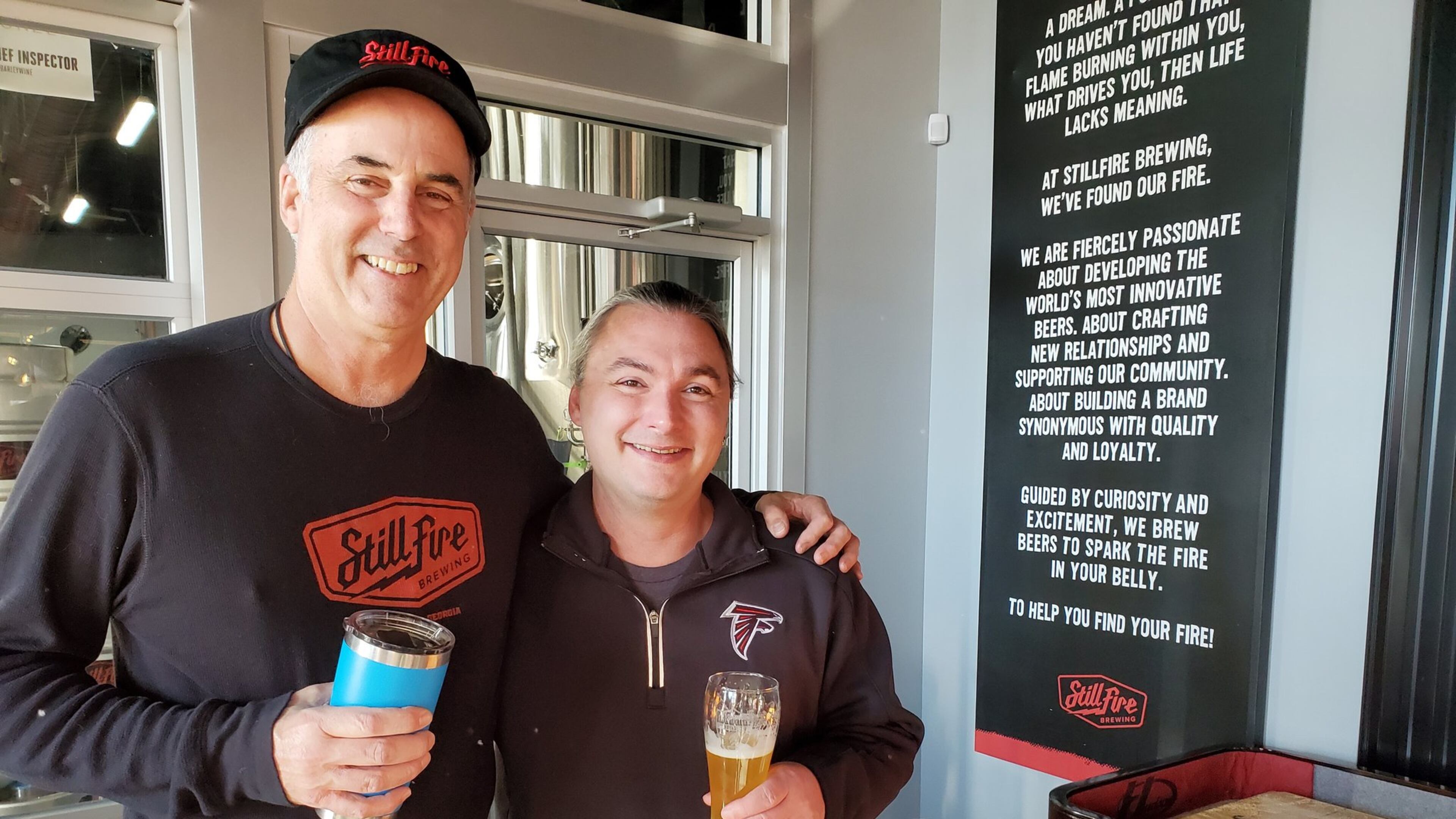 StillFire brewmaster Phil Farrell (left) with Matt Savitt, a regular customer who was celebrating with a beer and a cake for 100 consecutive days visiting the brewery. CONTRIBUTED BY STILLFIRE BREWING