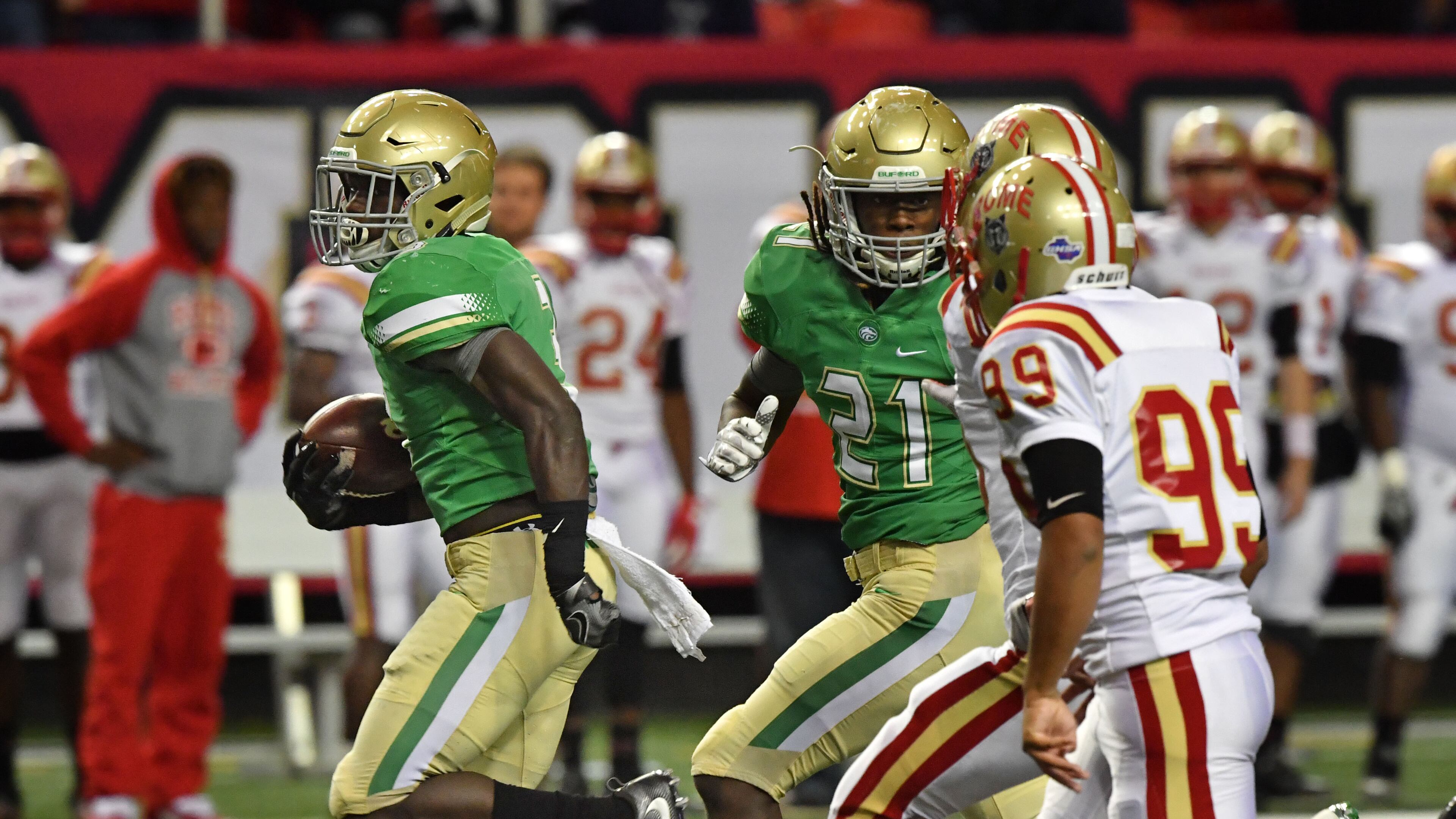 Buford running back Anthony Grant (3) runs for a first down then to the end zone in the first half of the Class 5A state championship game at the Georgia Dome.