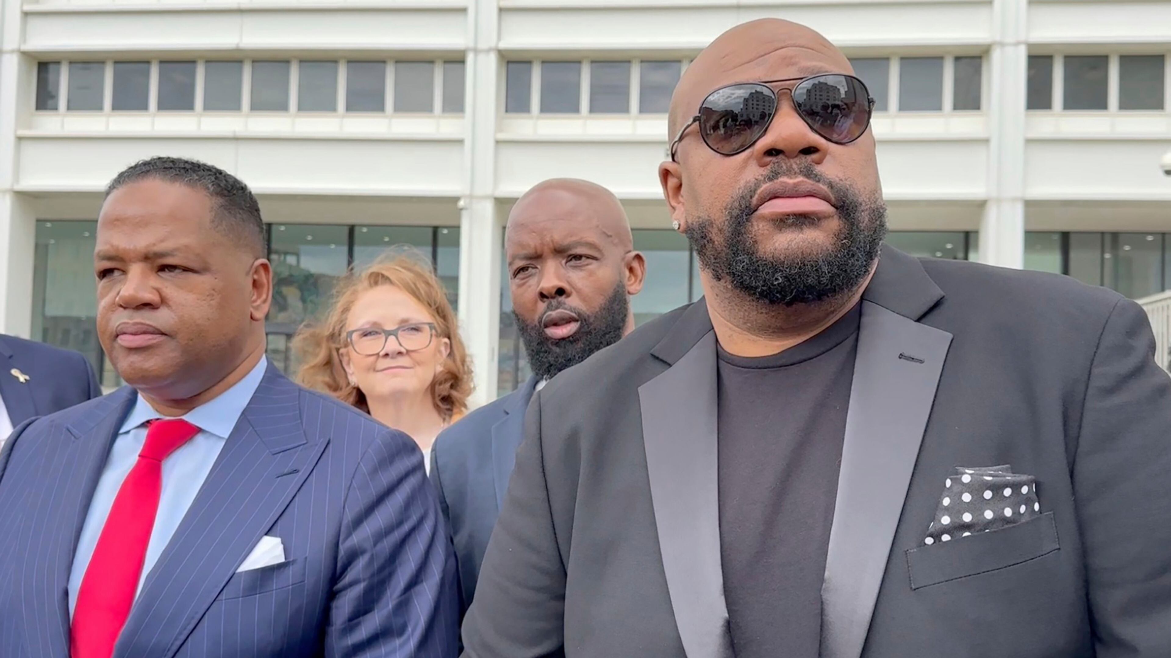 FILE - Isaac Hayes III, right, and his attorney address reporters outside a federal courthouse in Atlanta, Sept. 3, 2024. (AP Photo/Kate Brumback, File)