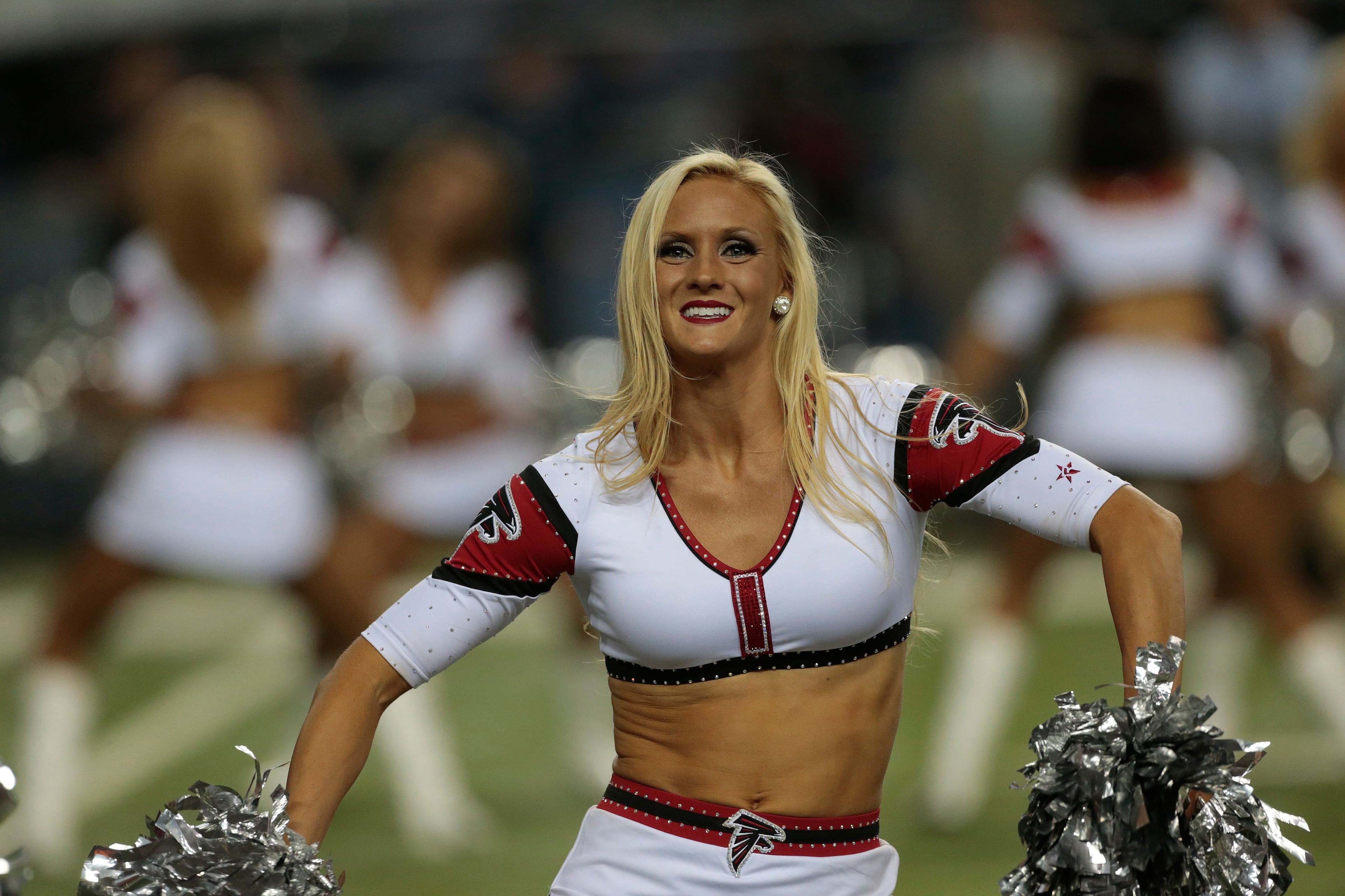 Atlanta Falcons cheerleaders perform during the second half of an NFL football game against the Tampa Bay Buccaneers, Thursday, Sept. 18, 2014, in Atlanta. (AP Photo/John Bazemore)