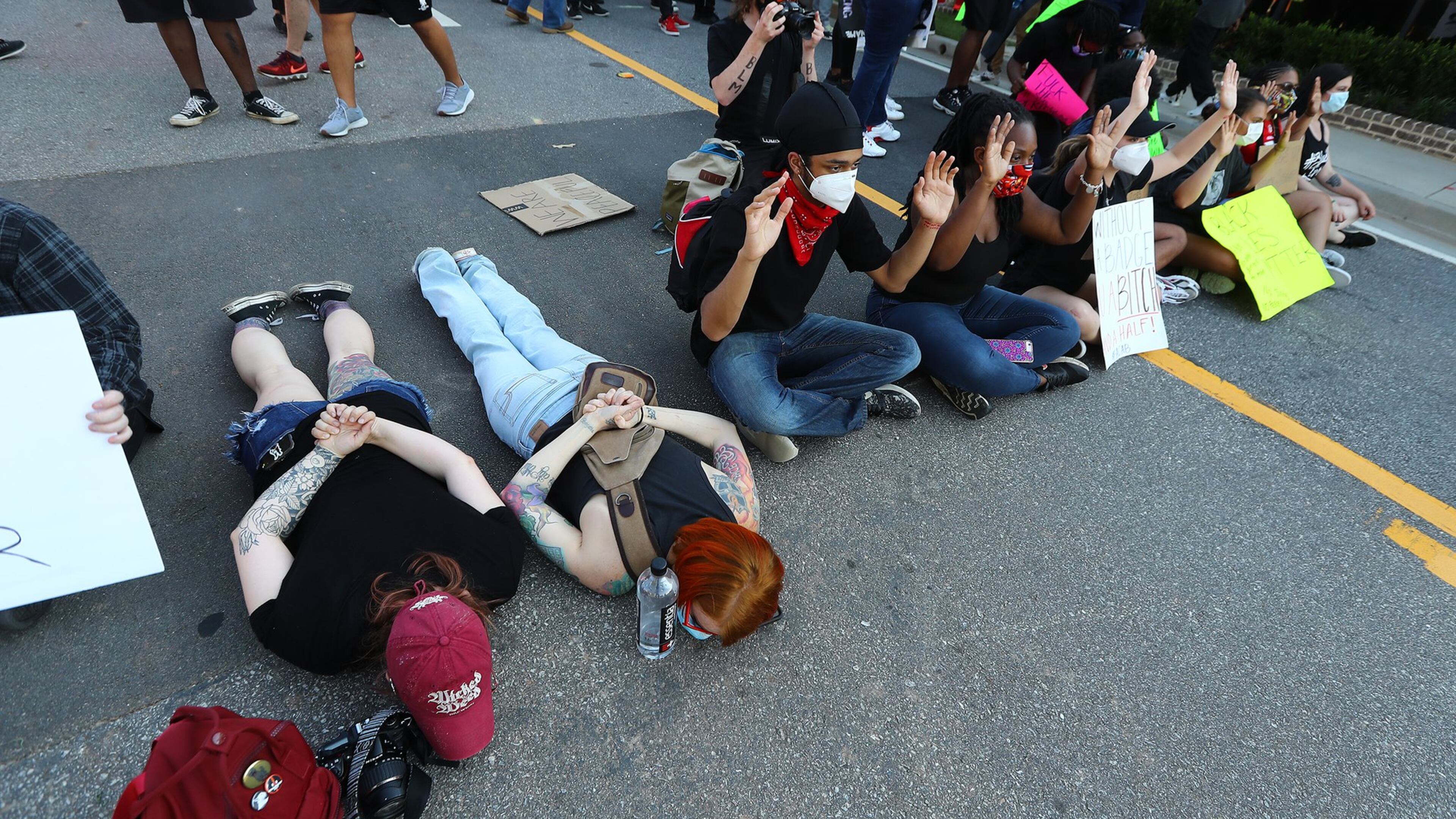 Protesters block South Clayton Street a few blocks from Lawrenceville City Hall as protests continue for a fourth day around metro Atlanta over the death of George Floyd on Monday, June 1, 2020, in Lawrenceville. CURTIS COMPTON CCOMPTON@AJC.COM