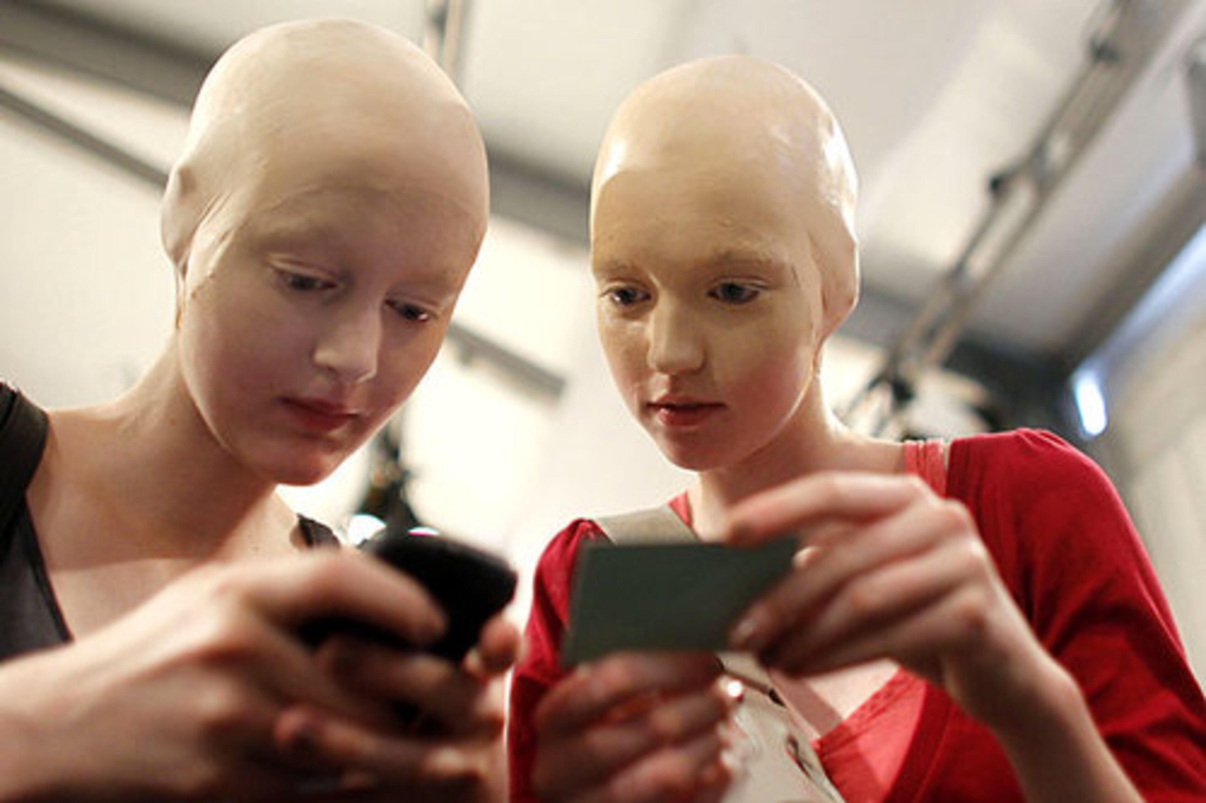 Model Michaela Kurzova, left, talks to an other unidentified model during preparations.