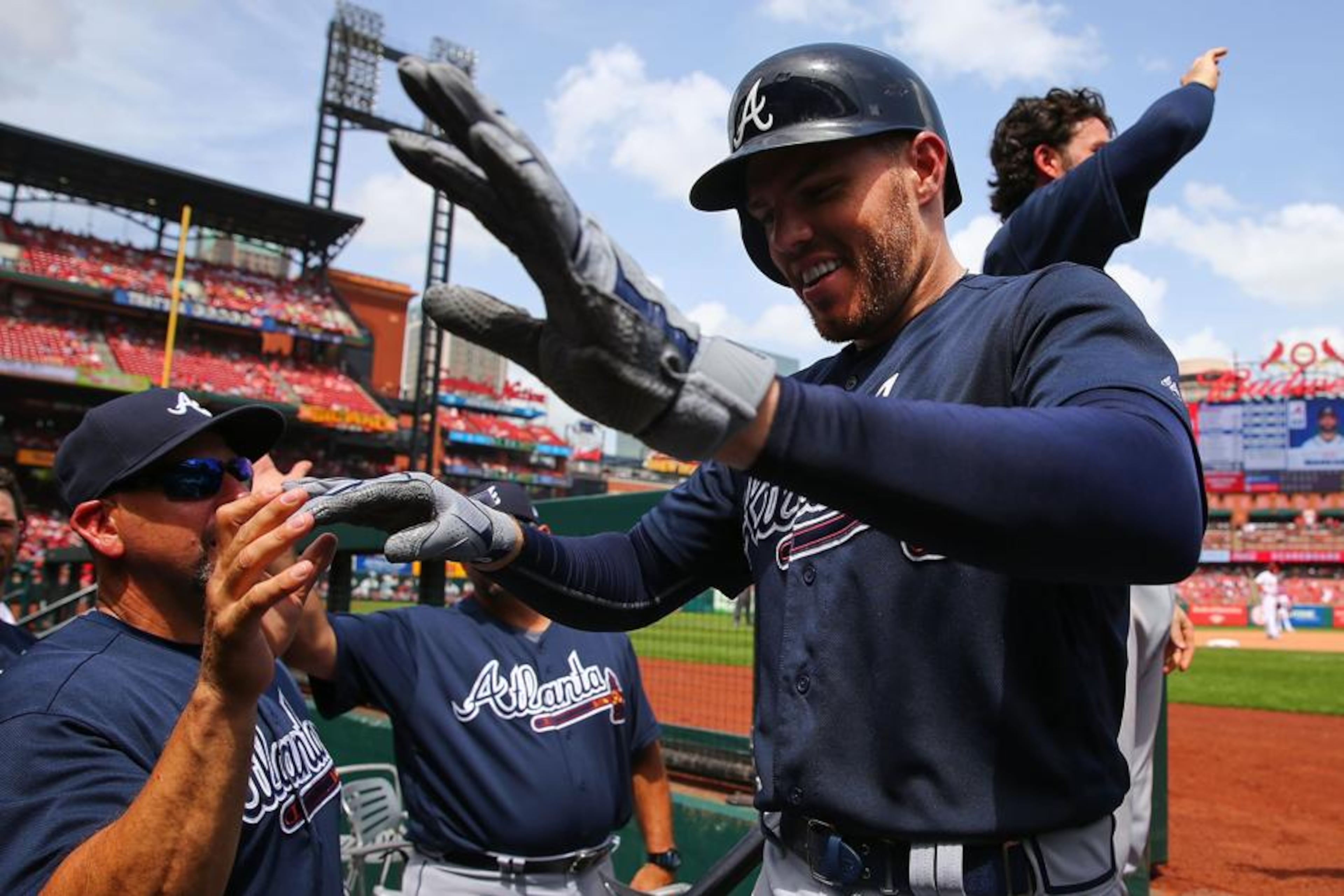 Braves' Freddie Freeman is congratulated after hitting a two-run home run against the St. Louis Cardinals in the sixth inning at Busch Stadium on July 1, 2018, in St. Louis. (Dilip Vishwanat/Getty images)