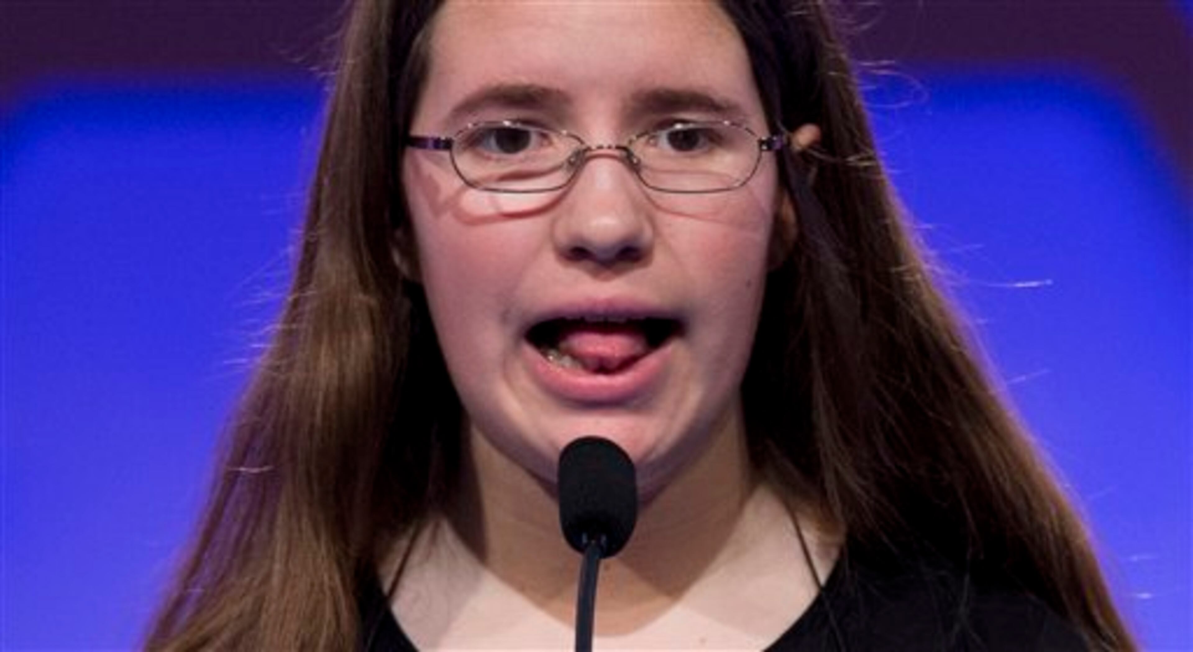 Rachael Cundey, of Evans, Ga., spells the word "lokshen" correctly during the second round of the National Spelling Bee, Wednesday, May 29, 2013, in Oxon Hill, Md. (AP Photo/Evan Vucci)