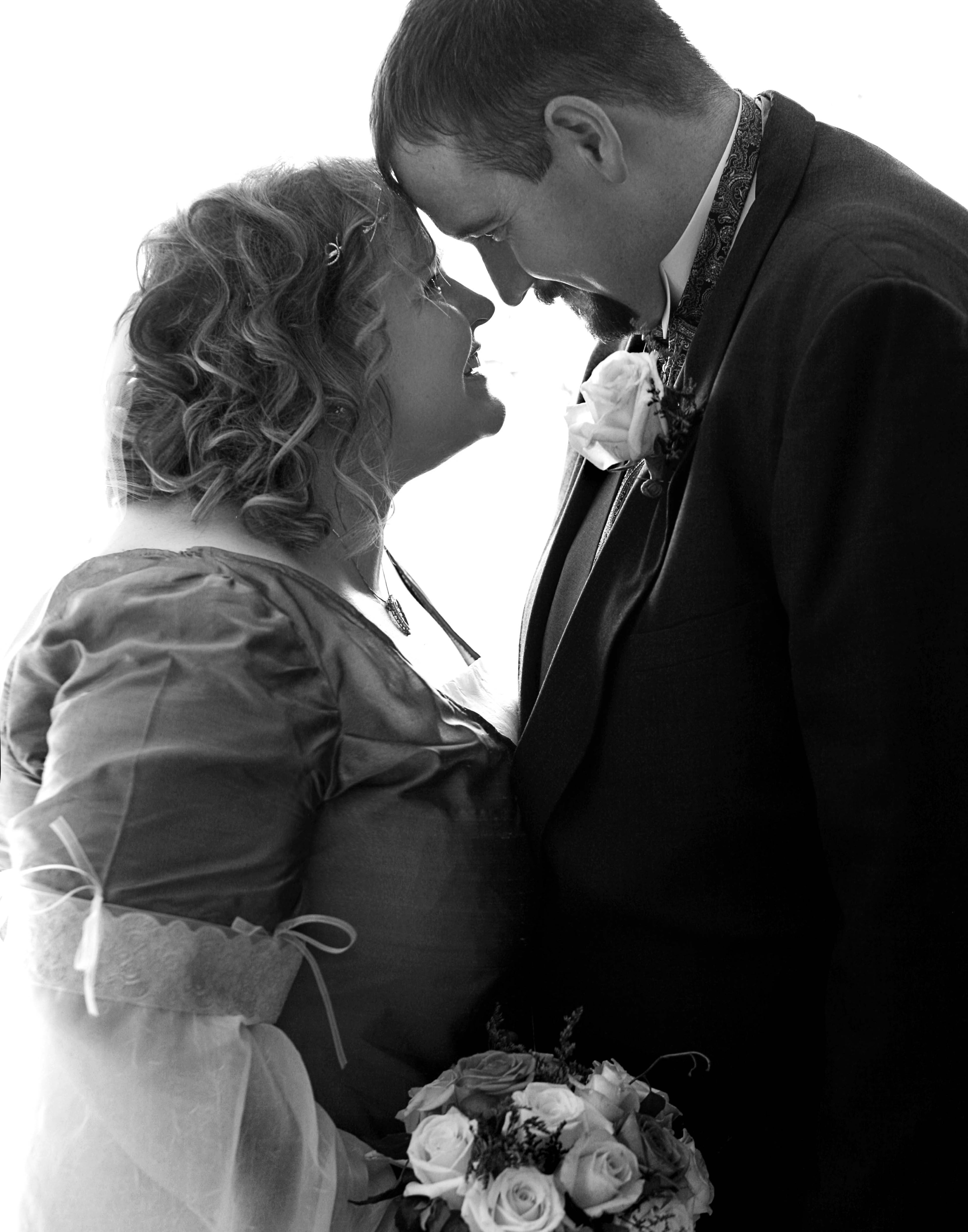 Tyra and Shane Burton met at an Emerald Rose concert at Dragon Con at the downtown Hilton Atlanta in 2009 and married on July 3, 2010, at Lake Allatoona Inn in Cartersville. (Courtesy of Fox Gradin)