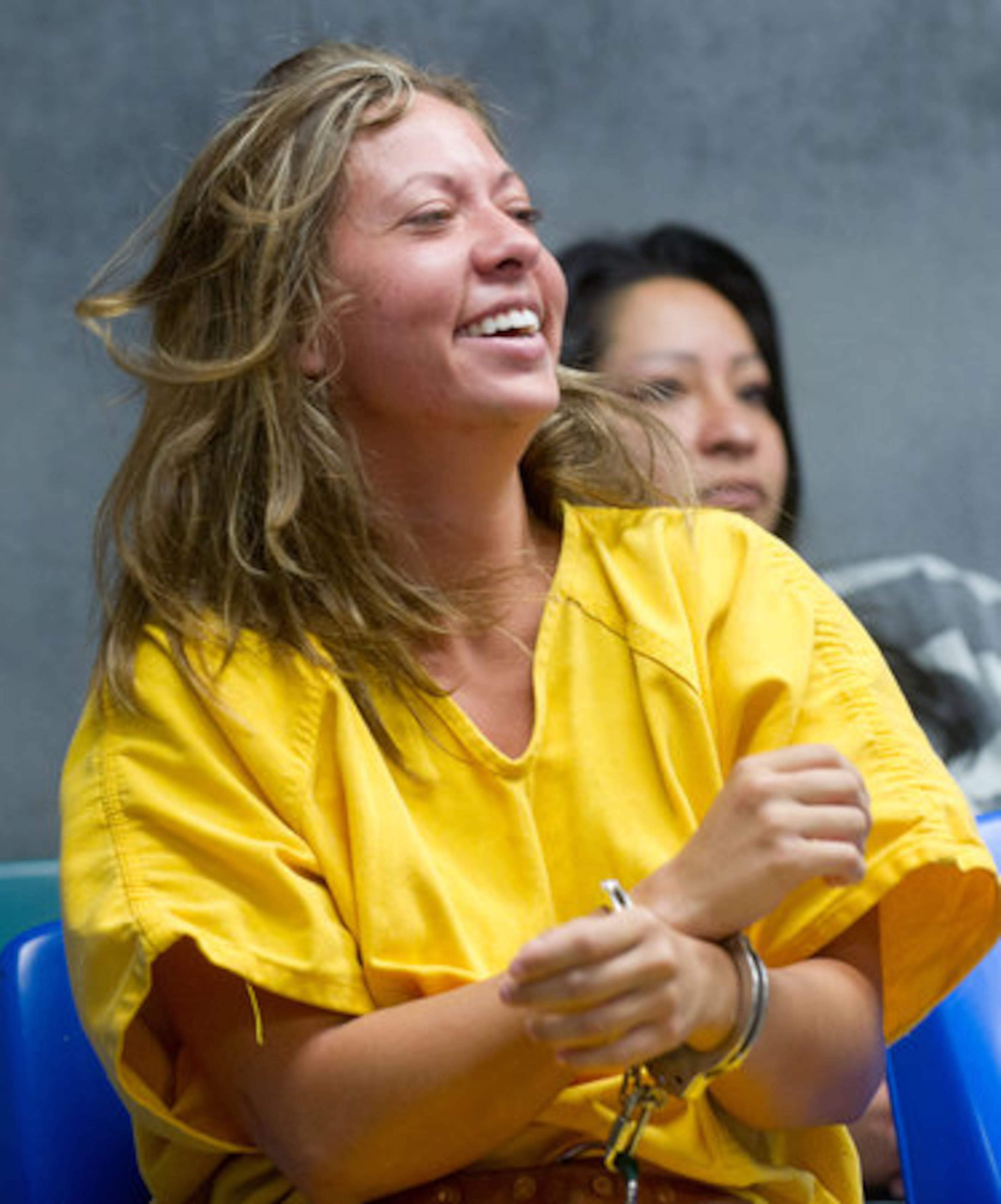 Investigators said that when they asked her about gunfire during the chase, Lee Dougherty said she thought authorities were firing at them. An affidavit says she told police, "I deserved to get shot."