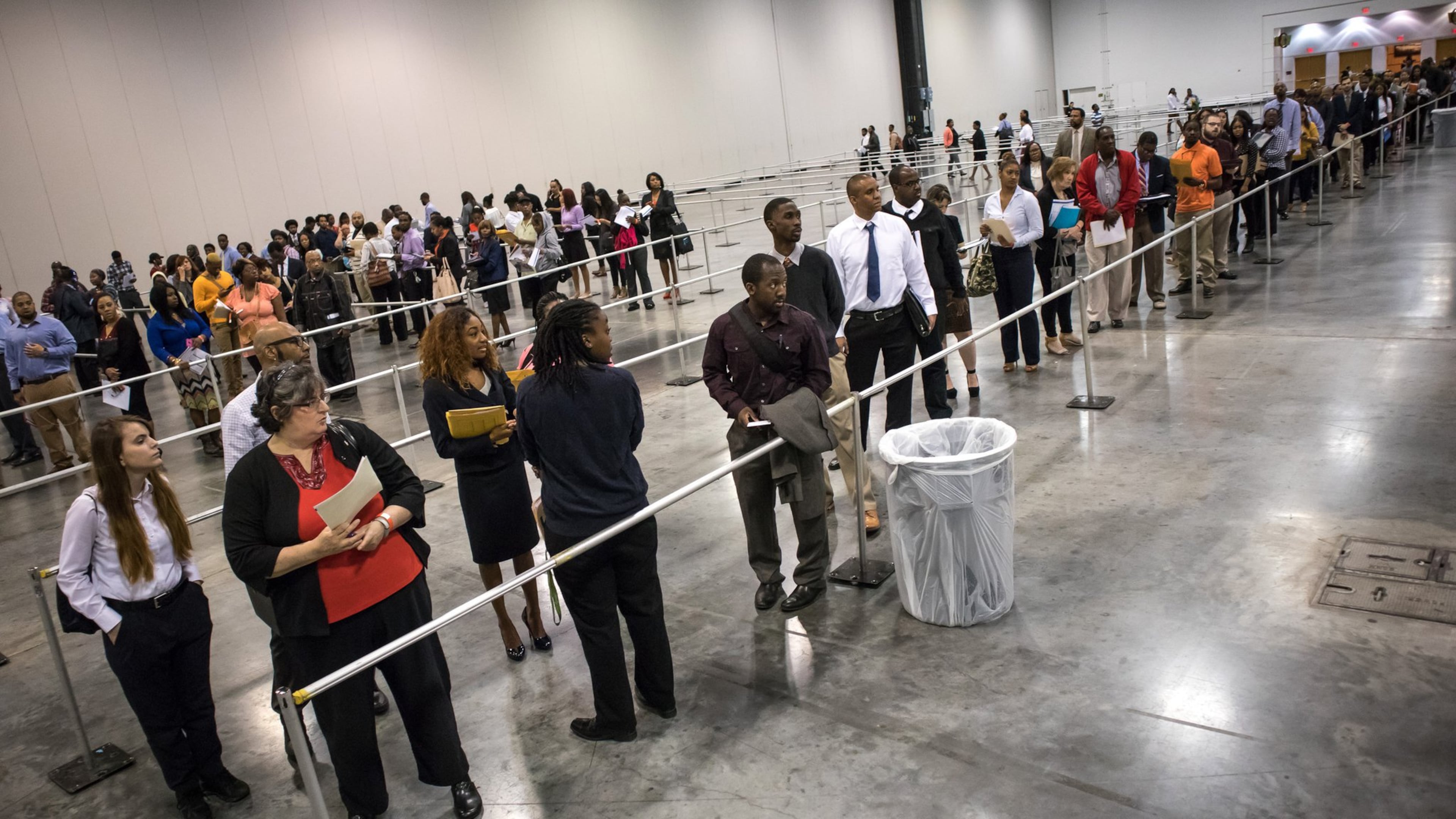 Jobseekers line up at a job fair for the Atlanta airport community in March. STEVE SCHAEFER / SPECIAL TO THE AJC