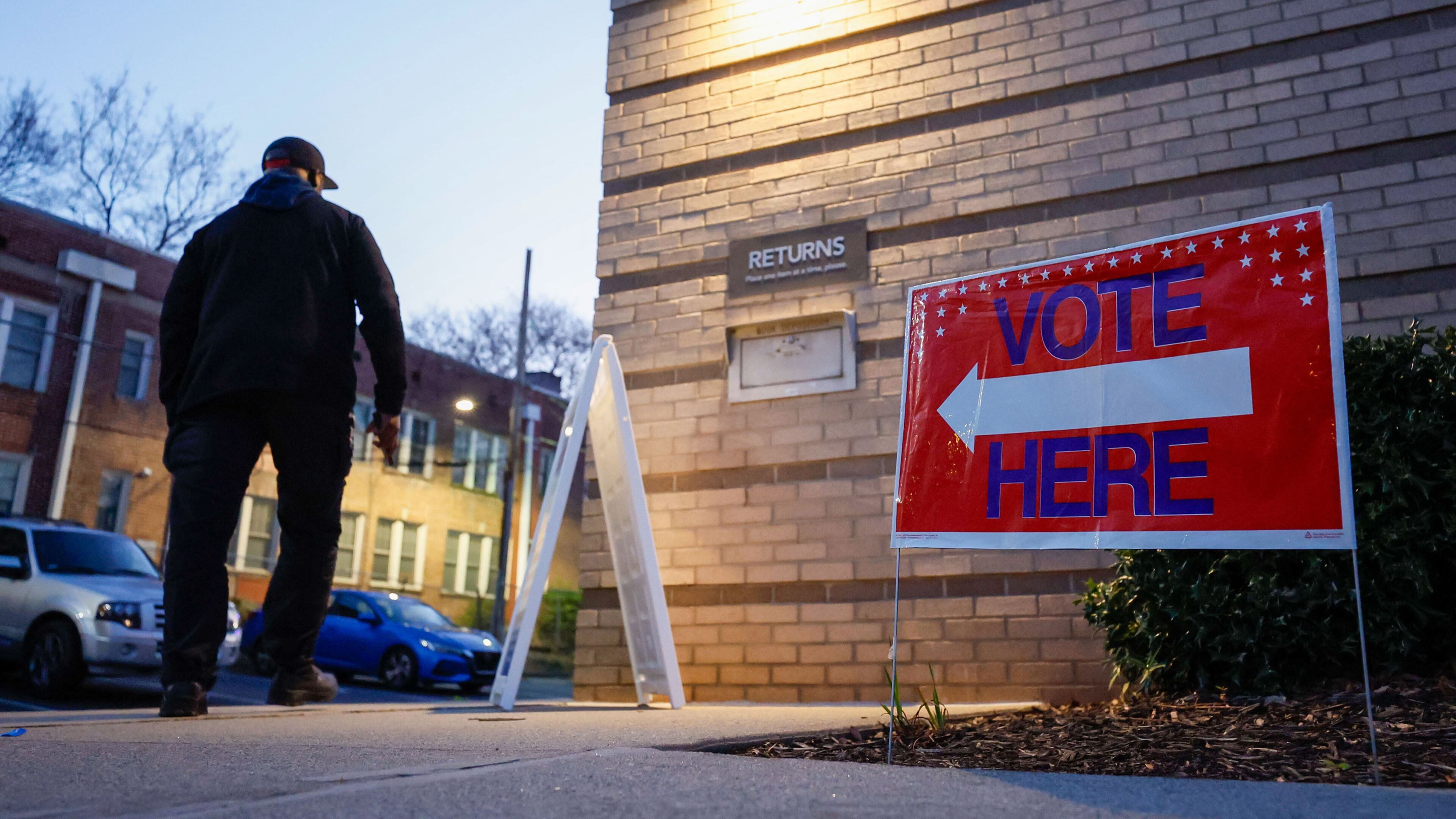 A person walks into the Joan P. Garner Library at Ponce De Leon as the polls open for Georgia for the presidential primary on Tuesday, March 12, 2024. Miguel Martinez/The Atlanta Journal-Constitution/TNS)
