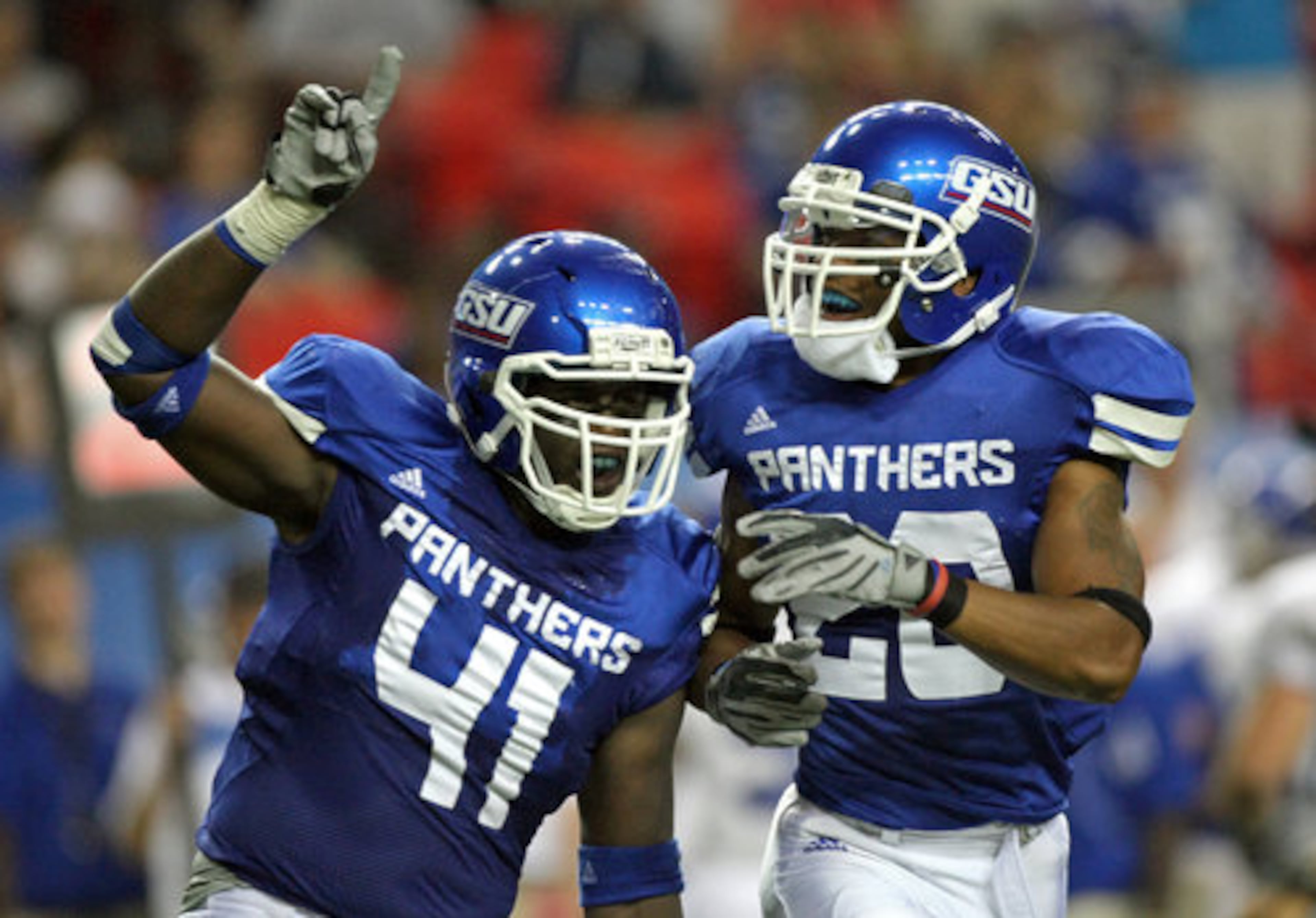 GSU inside linebacker Olufemi Opanubi (41, left) and safety Brandon Jones (20) celebrate GSU's fumble recover against Shorter College in the first half of GSU's inaugural game in the Georgia Dome Thursday night in Atlanta, Ga., Sept. 2, 2010.