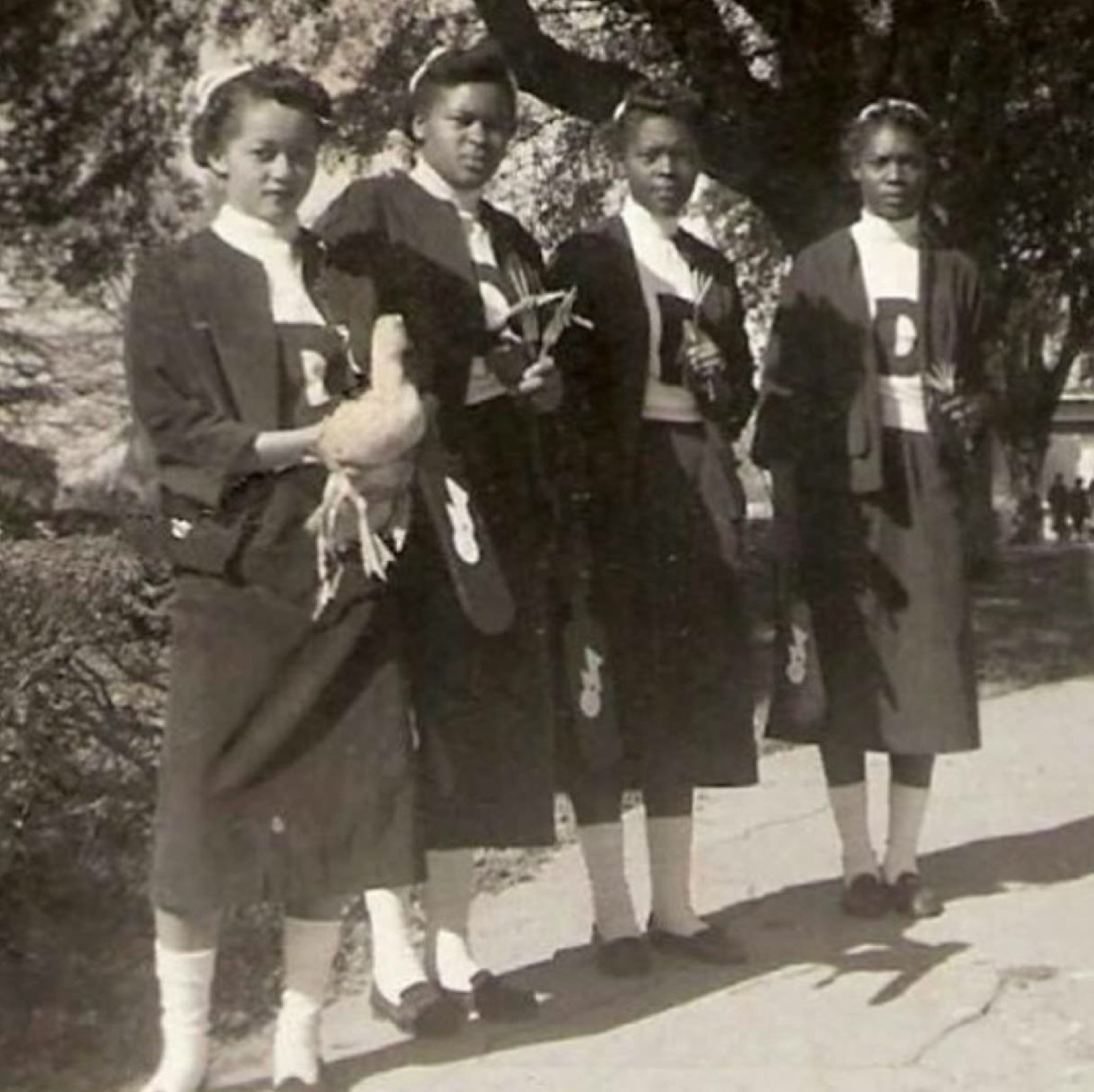 The first Delta line ever at Albany State University pledged in 1953. The head of the line is carrying a live duck, a symbol of Delta Sigma Theta.