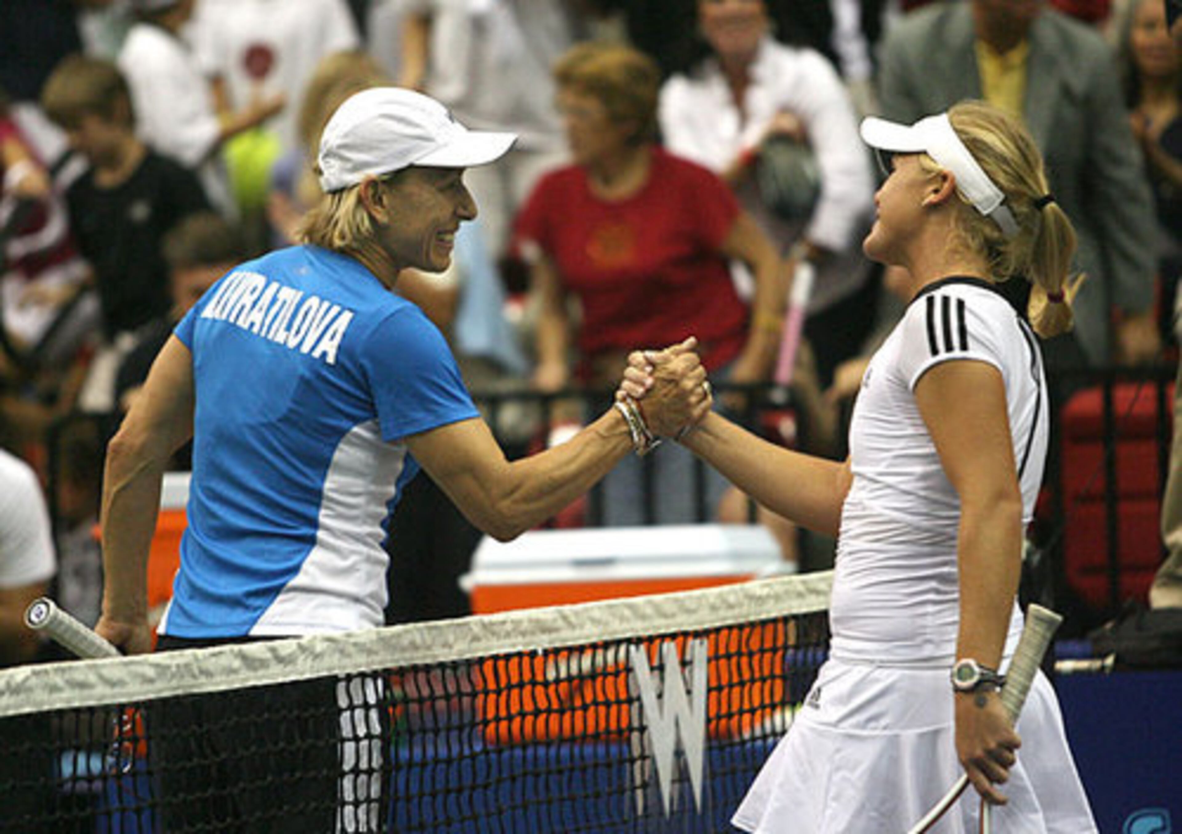 Martina Navratilova congratulates Melanie Oudin (right), 17, of Marietta after Oudin won a singles match-up against Navratilova during the Advanta WTT Smash Hits tennis event. Oudin is the top ranked American junior player and No. 2 in the world.