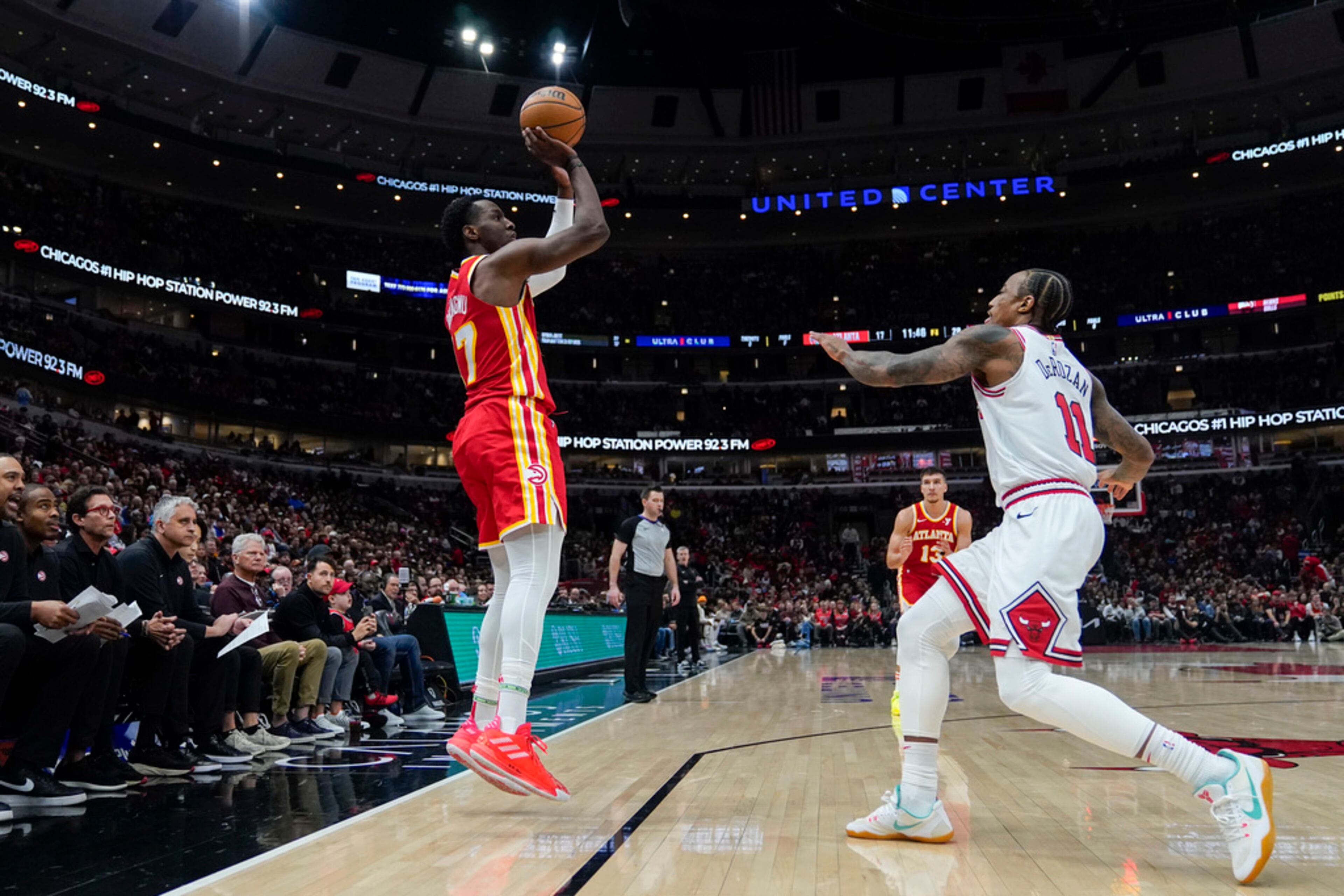 Atlanta Hawks forward Onyeka Okongwu shoots a 3-pointer over Chicago Bulls forward DeMar DeRozan during the first half of an NBA basketball game Tuesday, Dec. 26, 2023, in Chicago. (AP Photo/Erin Hooley)