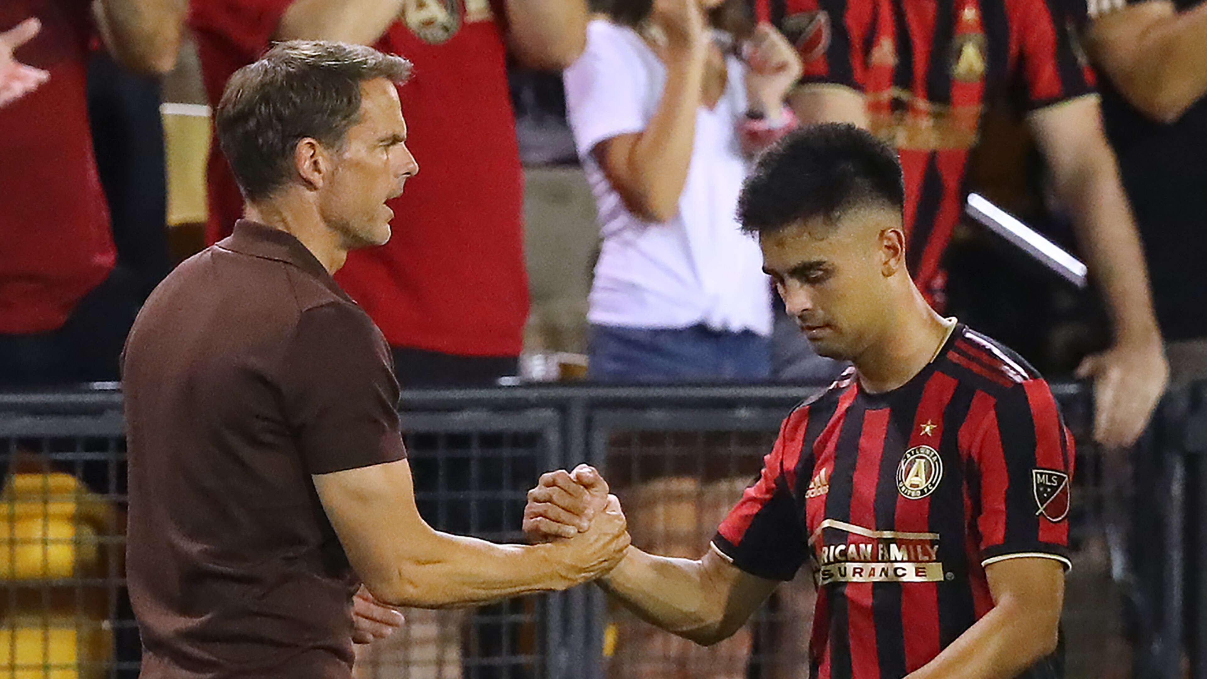 July 10, 2019 Kennesaw: Atlanta United midfielder Pity Martinez gets five from head coach Frank de Boer during a 2-0 victory over St. Louis in a U.S. Open Cup quarterfinals soccer match on Wednesday, July 10, 2019, in Kennesaw. Martinez scored Atlanta Unitedâs first goal in the game. Curtis Compton/ccompton@ajc.com
