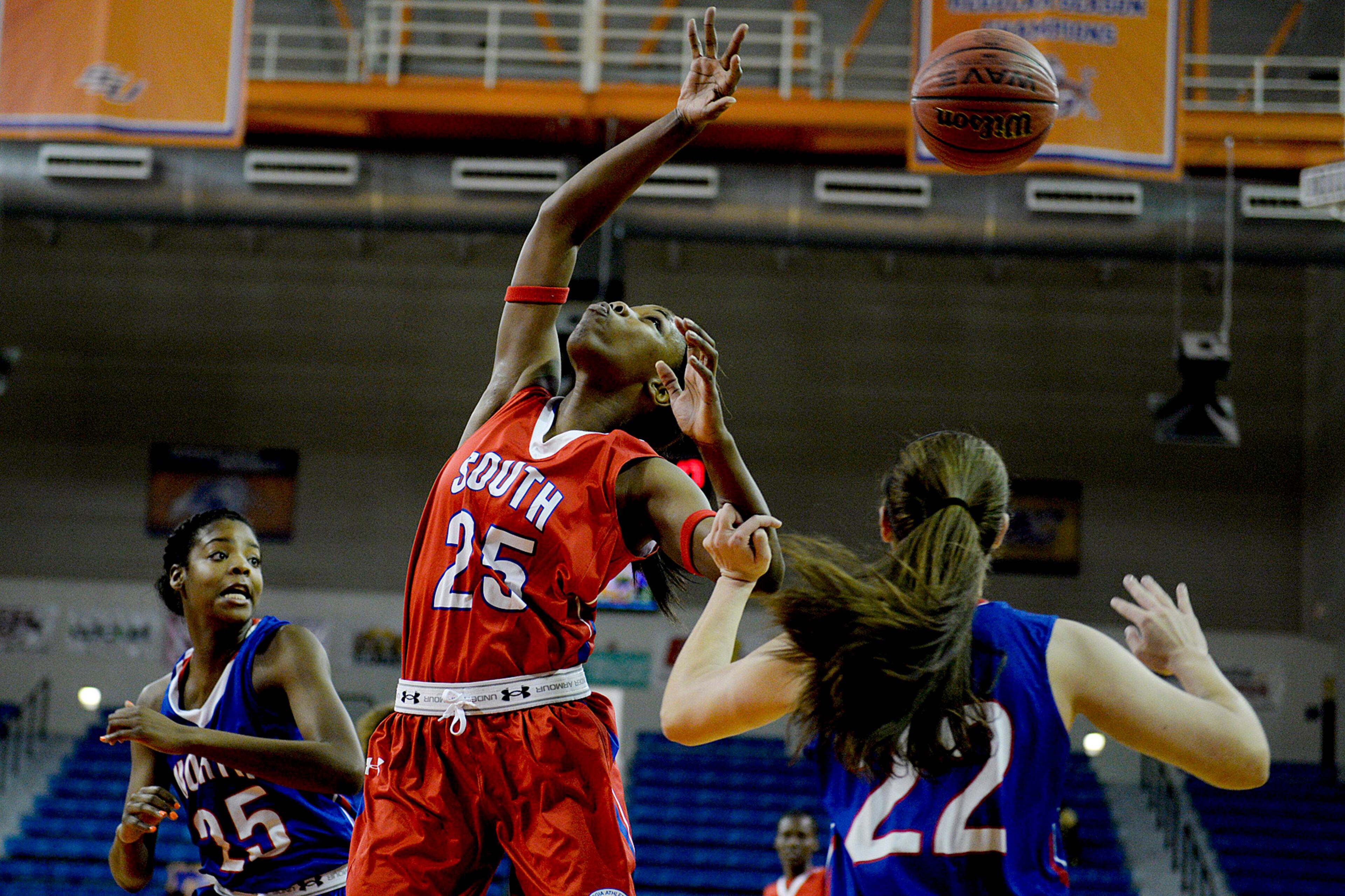 Tift County senior Moneisha Gildsborough attempts to gather a rebound during the Georgia Athletic Coaches Association North-South All-Star Game at Savannah State in Savannah, Ga. on Saturday, March 21, 2015. (AP Photo/Savannah Morning News, Ian Maule)