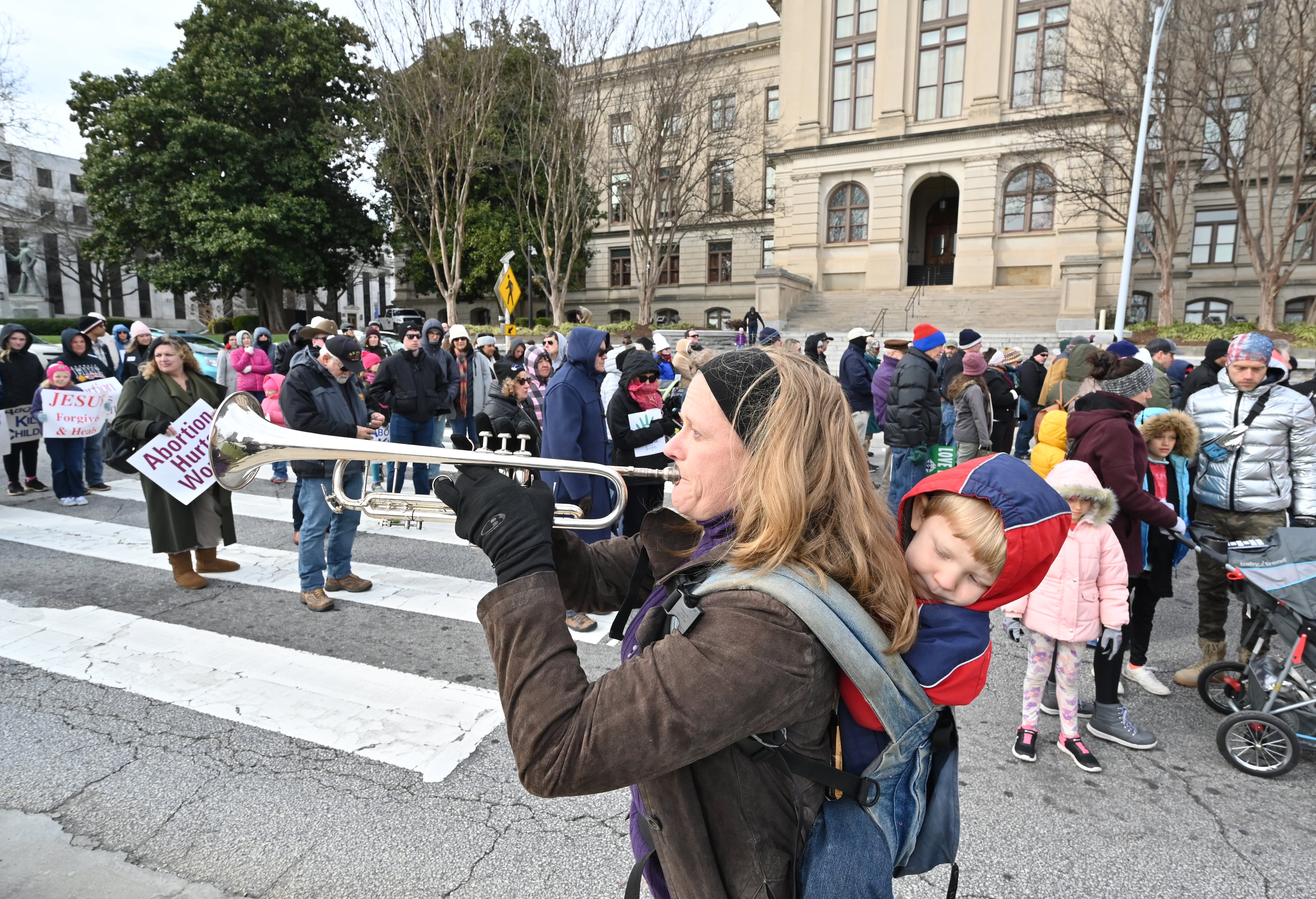 January 22, 2020 Atlanta - Hundreds of pro-life supporters leave Liberty Plaza across from the state capitol building during the 2020 Georgia March For Life & Memorial Service to raise awareness and support of anti-abortion legislation at Liberty Plaza on Wednesday, January 22, 2020. Anti-abortion advocates scored a win last year when Georgia passed a law that would ban the procedure once a doctor can detect fetal cardiac activity. But Georgia Right to Life had urged lawmakers to vote against it - and unendorsed several Republican candidates who voted in support of it - saying the bill did not go far enough because it allowed exceptions in instances of rape and incest. (Hyosub Shin / Hyosub.Shin@ajc.com)