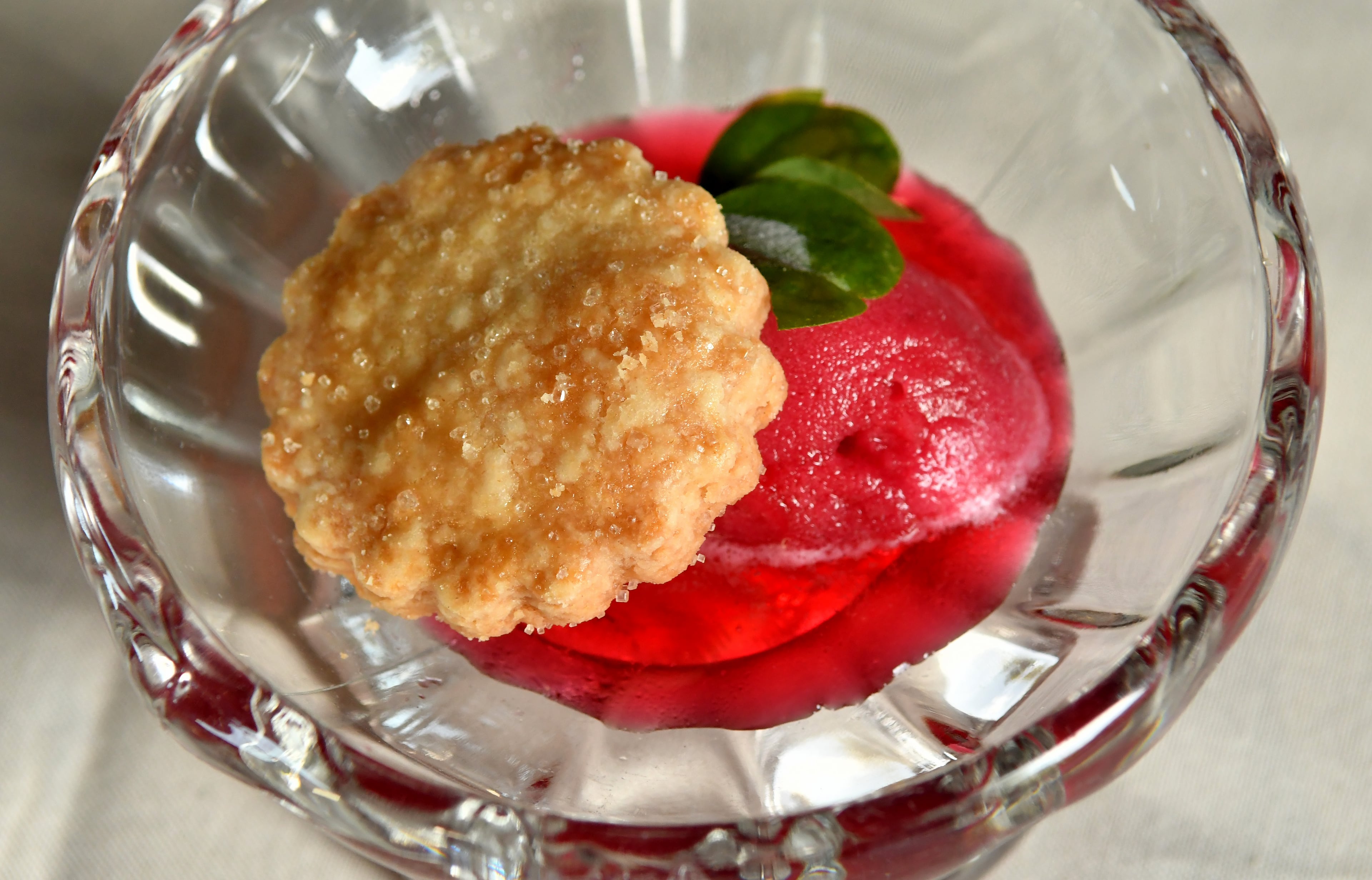 The first course of A Dinner at 29 was shortbread cookie served with hibiscus scotch bonnet sorbet. (CHRIS HUNT FOR THE ATLANTA JOURNAL-CONSTITUTION)