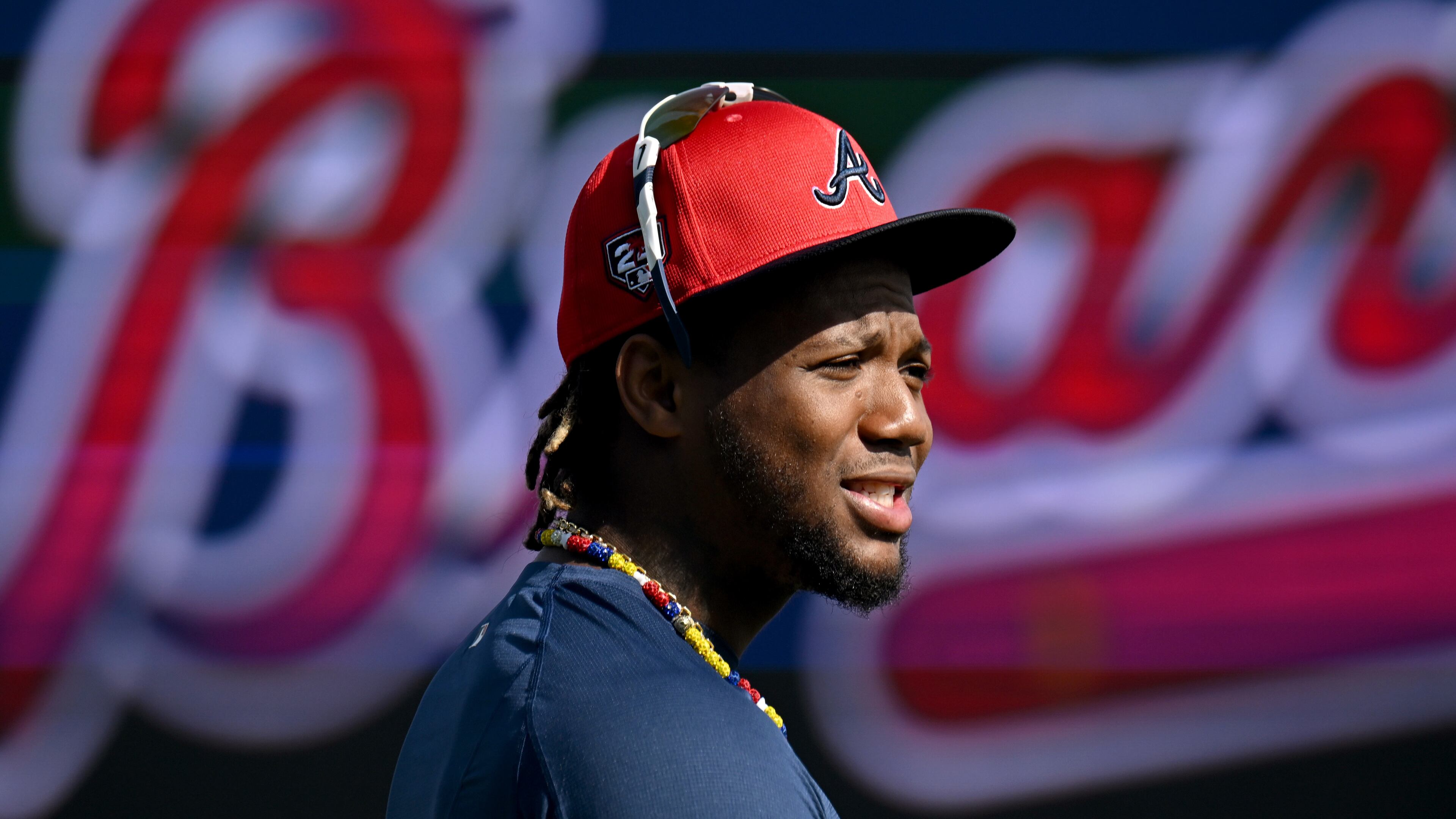 Atlanta Braves right fielder Ronald Acuna Jr. talks with teammates and coaching staff before taking batting practice during spring training workouts at CoolToday Park, Friday, February, 16, 2024, in North Port, Florida. (Hyosub Shin / Hyosub.Shin@ajc.com)