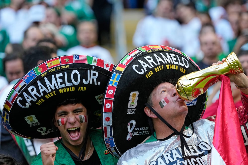 Hctor Chvez has watched Mexico's national team play more than 540 matches since 1986. He now attends with his son. (Natacha Pisarenko/AP)